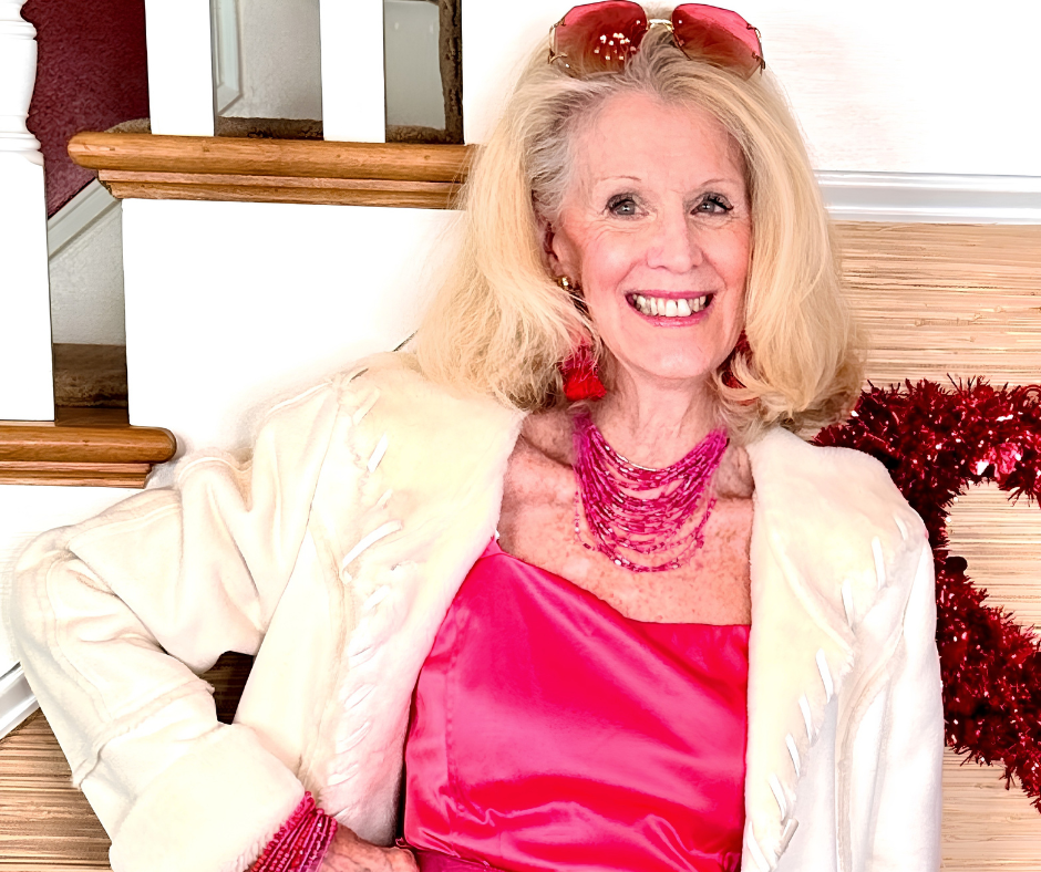 Brent Atwater, blonde woman 79 years old, smiling with sunglasses on her head