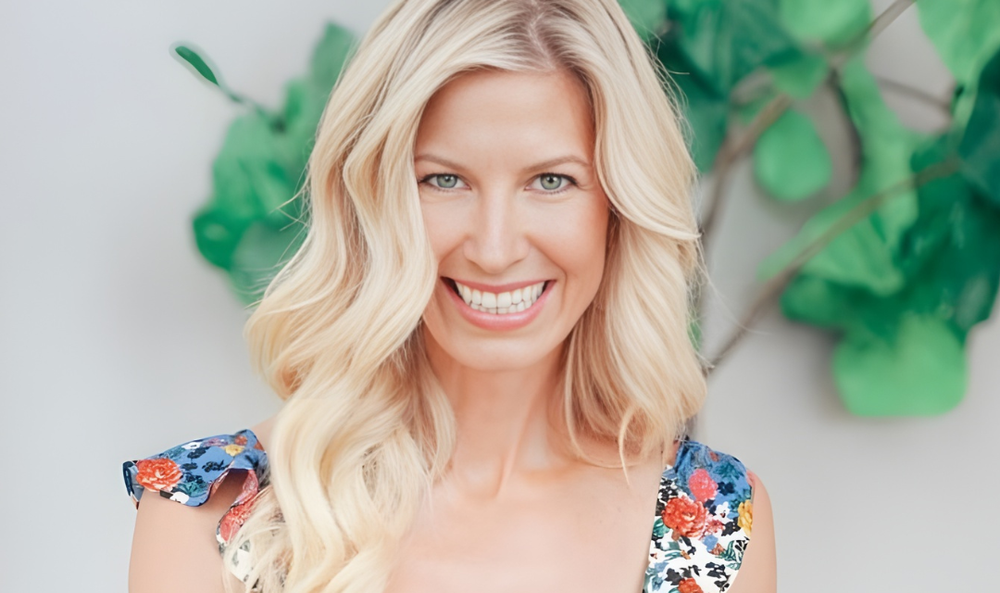 Lifestyle creator smiling in a floral dress