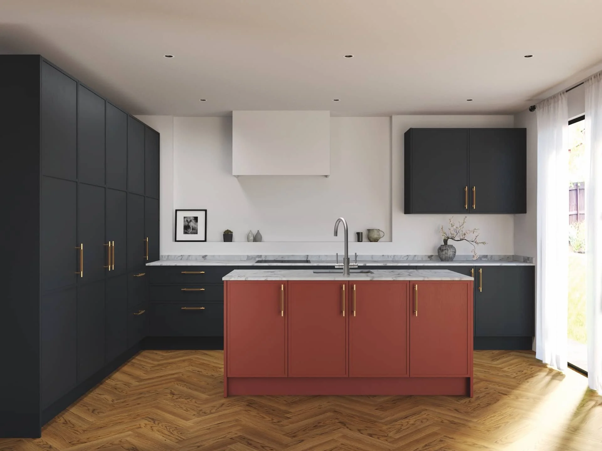 Modern kitchen with blue cabinets, a pink central island, gray marble countertops, and wooden flooring, illuminated by natural light from sliding glass doors.