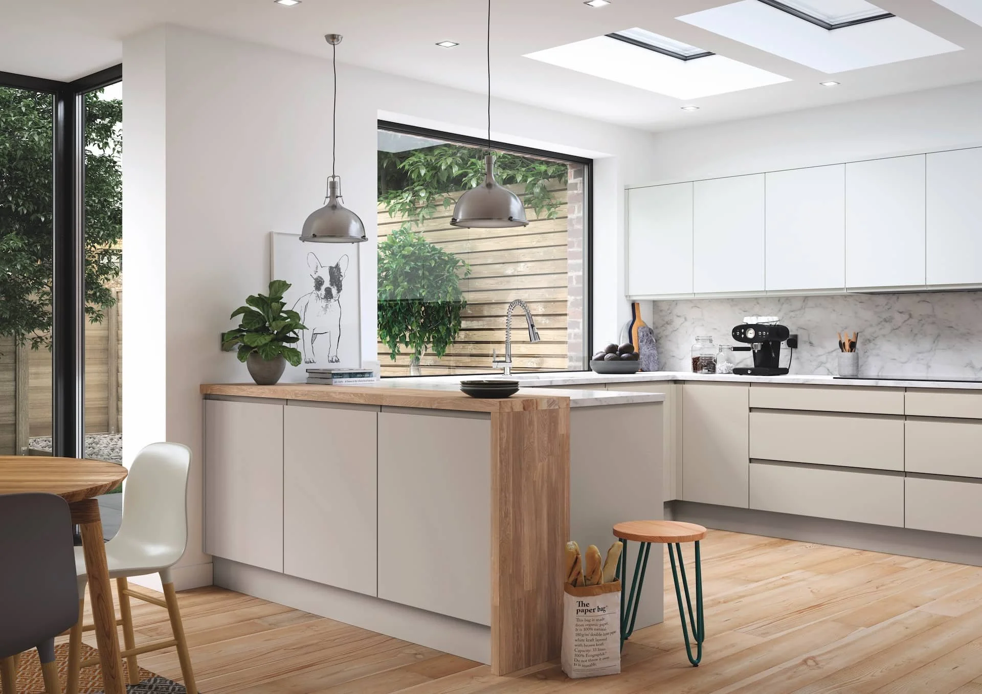 Modern kitchen with white cabinets, wooden accents, and large windows bringing in natural light. Contains a small kitchen island, a coffee machine, and decor items.