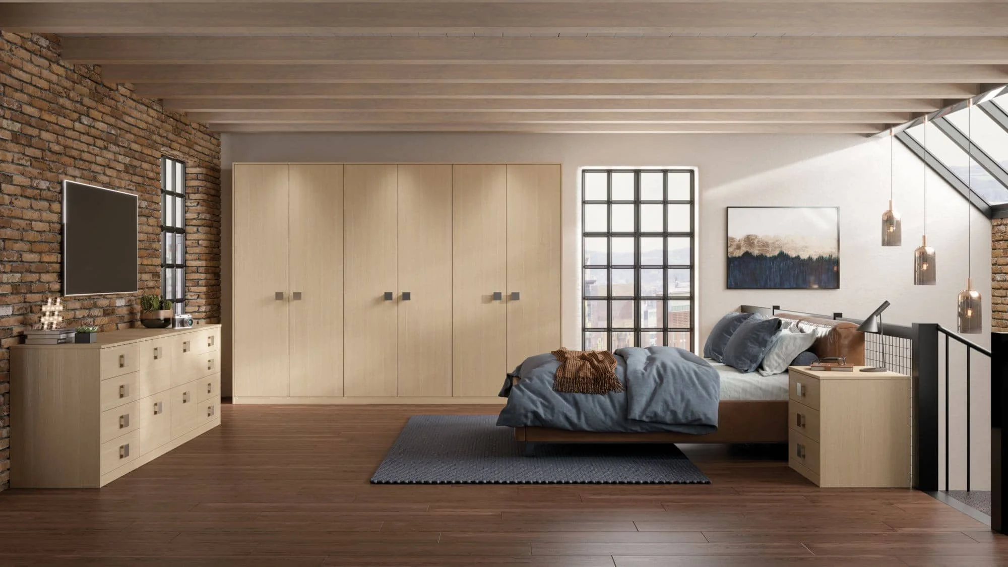 A modern bedroom with a wooden platform bed, blue bedding, and pillows. There is a nightstand with a desk lamp and a book. A large window with black framing, artwork on the white wall, and hanging pendant lights are visible. The room has a brick acce