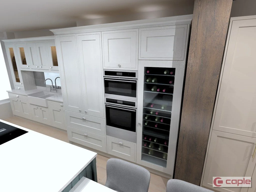 Kitchen with white cabinets, a double oven, a wine cooler, a sink with a faucet, and a countertop with chairs.