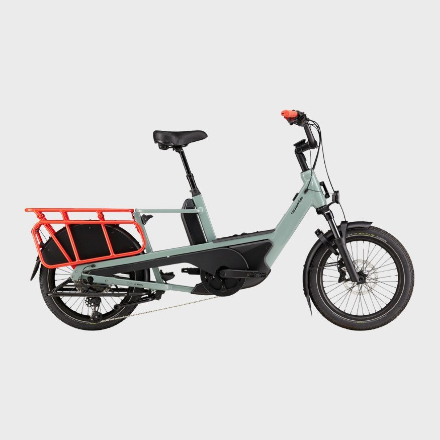 A modern electric cargo bicycle with a black saddle, black handlebars, and a red rear cargo rack.