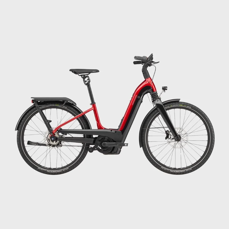 Red and black electric bicycle against a plain gray background.