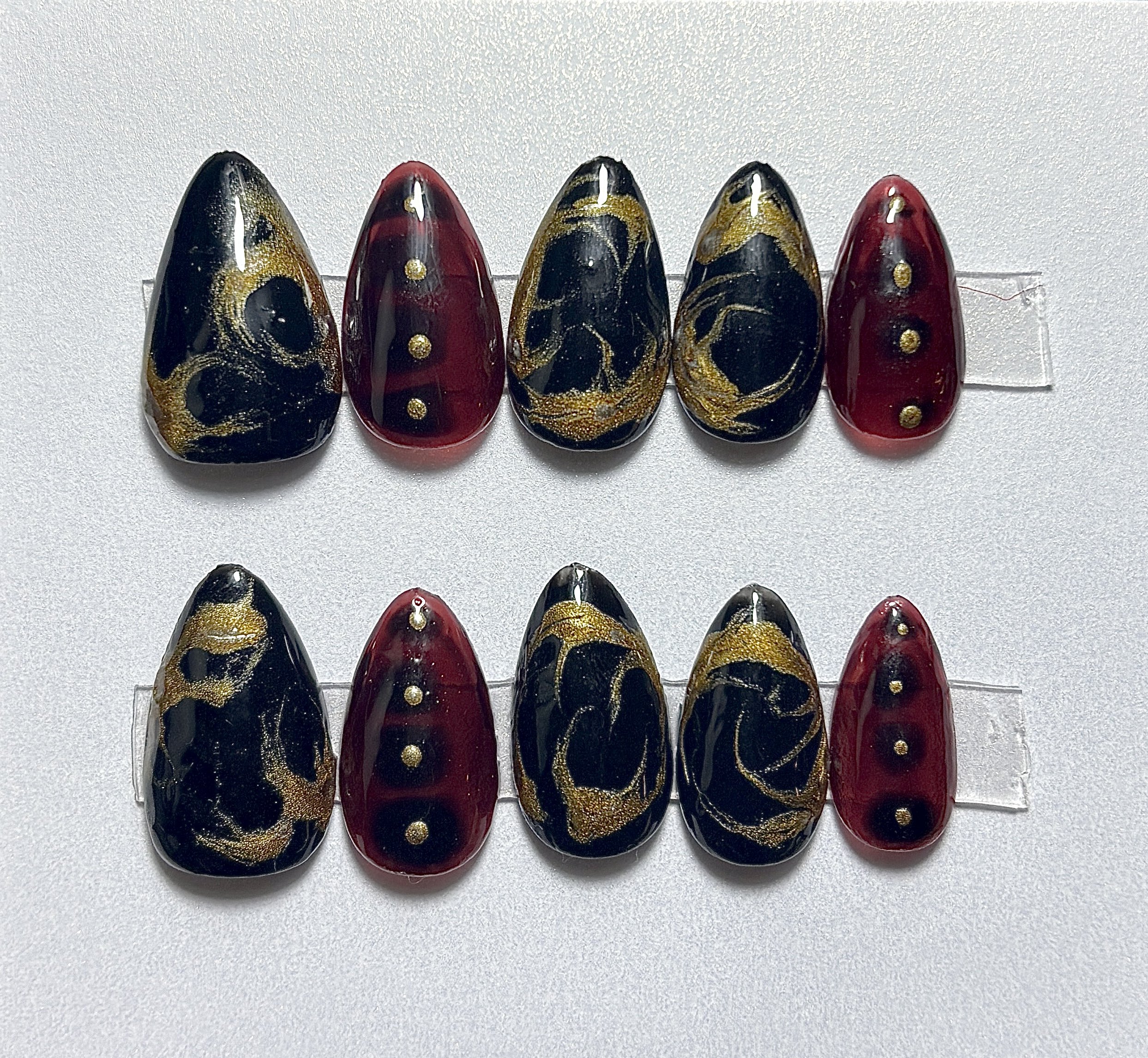 Black, Red, and Gold Nails