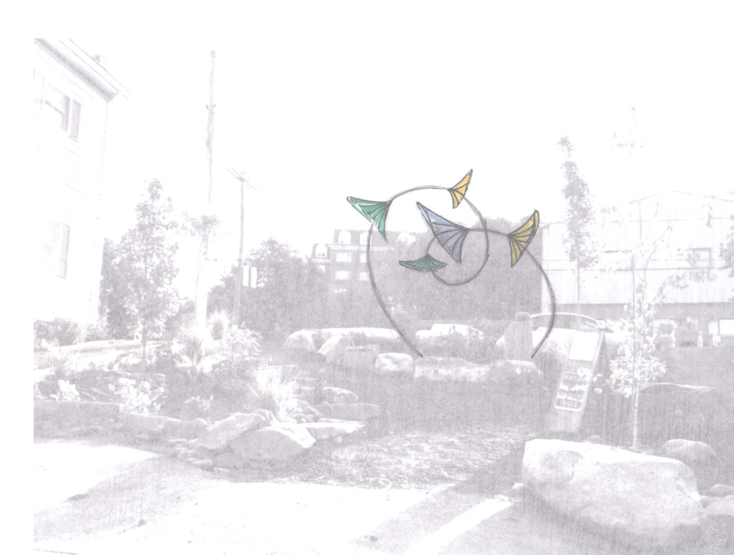 Colorful metal fish-shaped wind sculpture in an outdoor garden with trees and rocks.