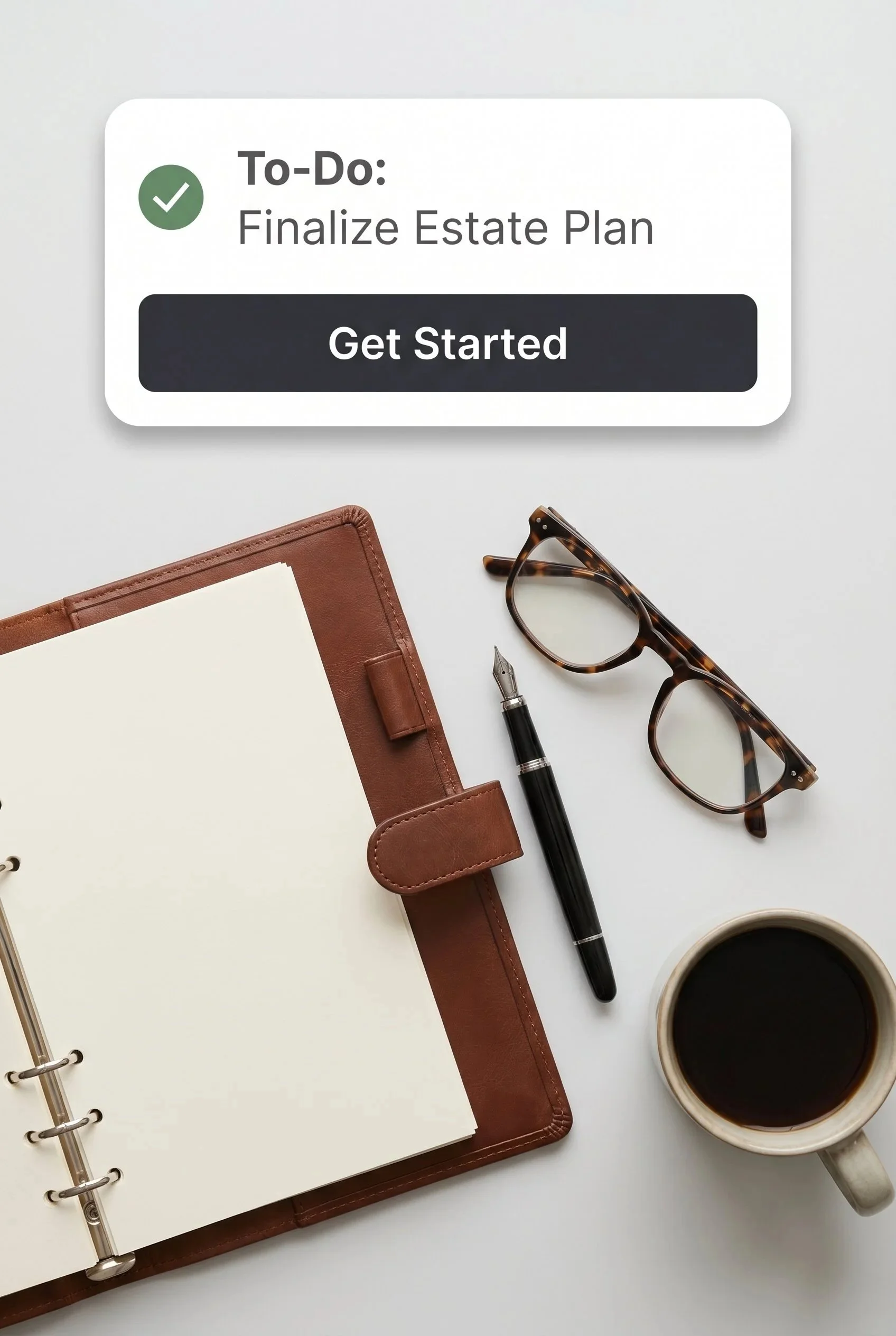 A desk with a white open notebook, a black pen, tortoiseshell glasses, a cup of black coffee, a reddish-brown planner, and a digital tablet. There is a pop-up notification on the tablet screen that says 'To-Do: Finalize Estate Plan' with a green checkmark and a 'Get Started' button.