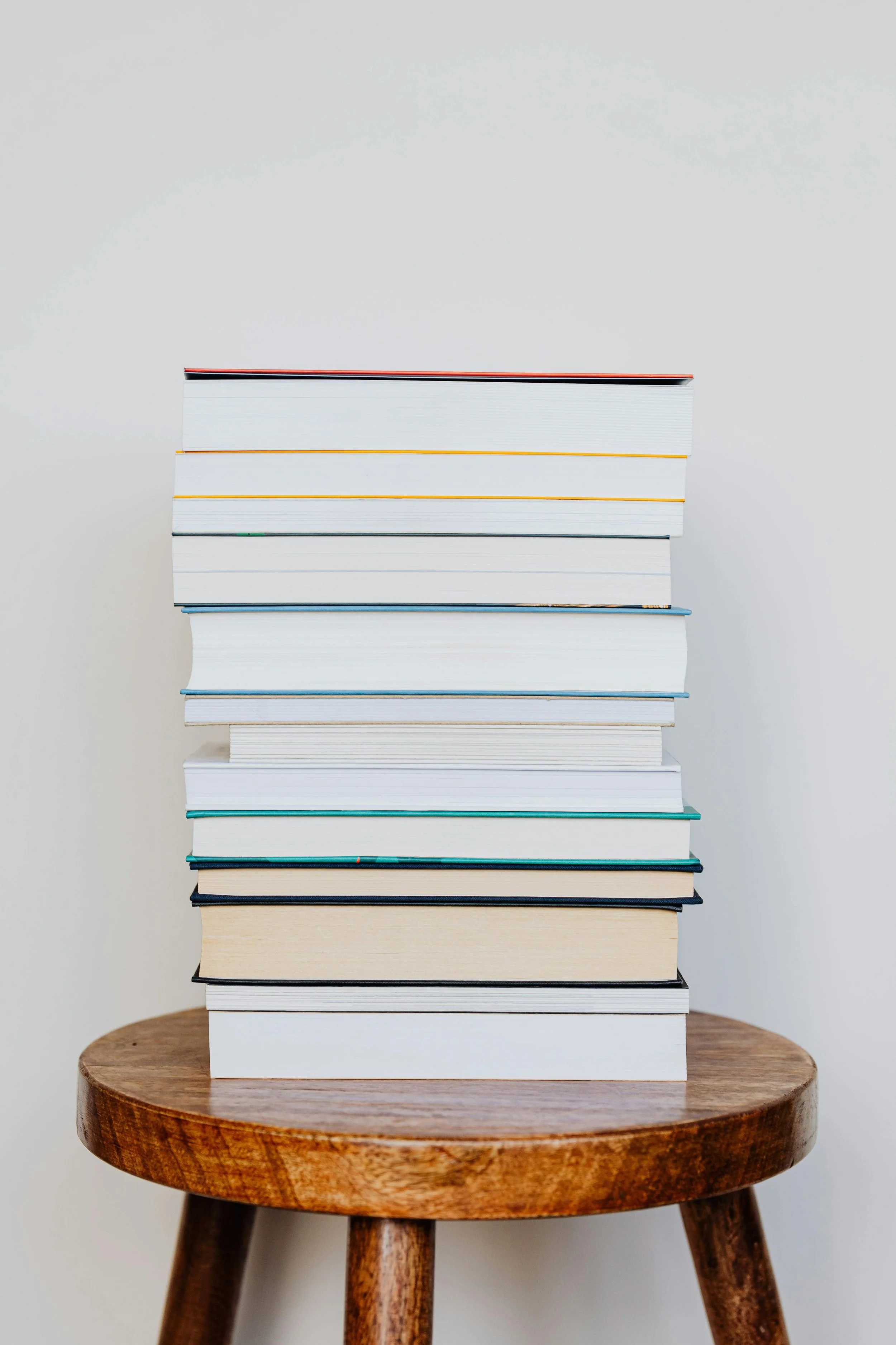 Books stacked on chair
