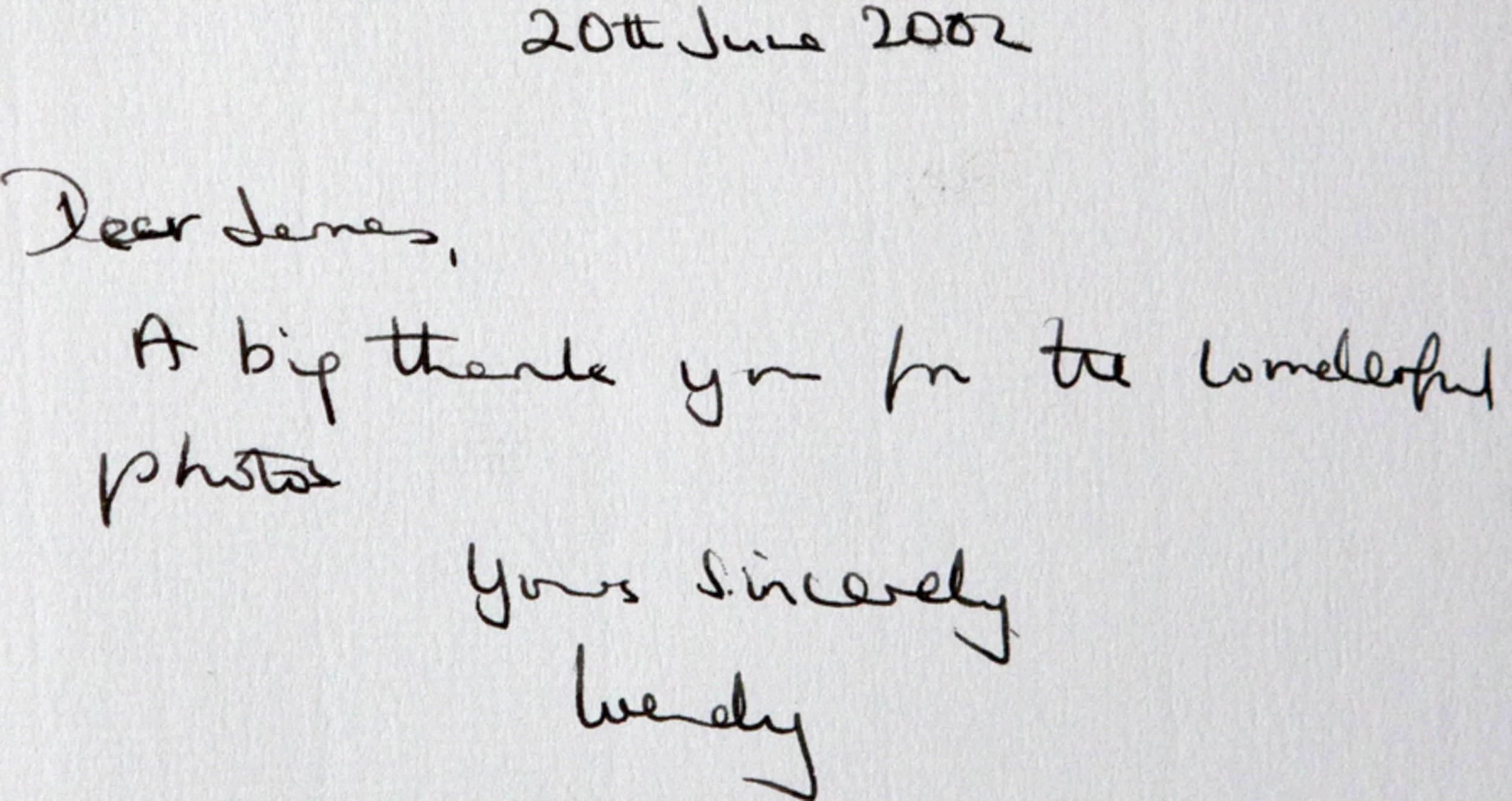 Handwritten note dated June 20, 2002, addressed to James, thanking him for a wonderful photo, signed sincerely weekly.