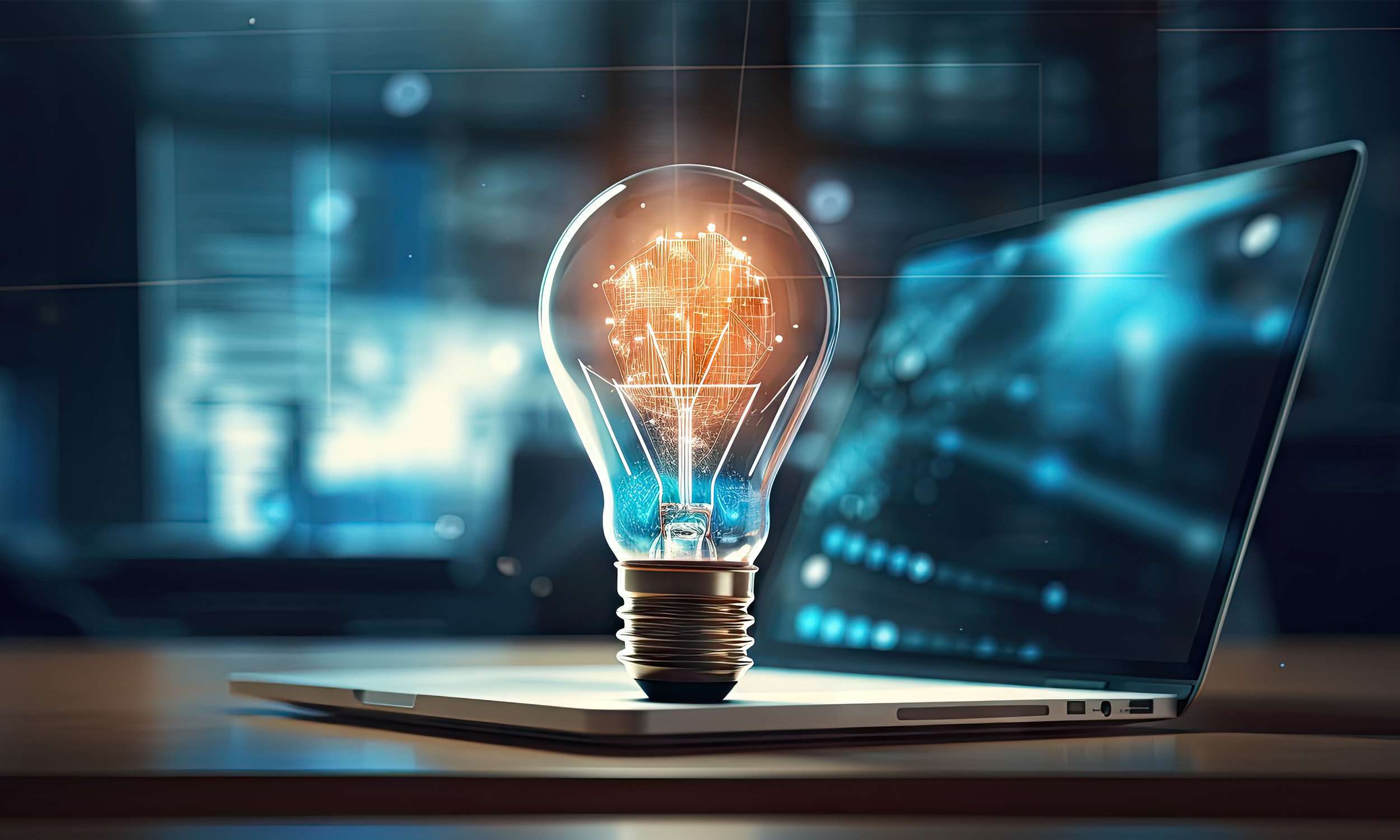 A digital illustration of a glowing light bulb with a circuit-like filament, placed on a laptop keyboard in a modern office setting.