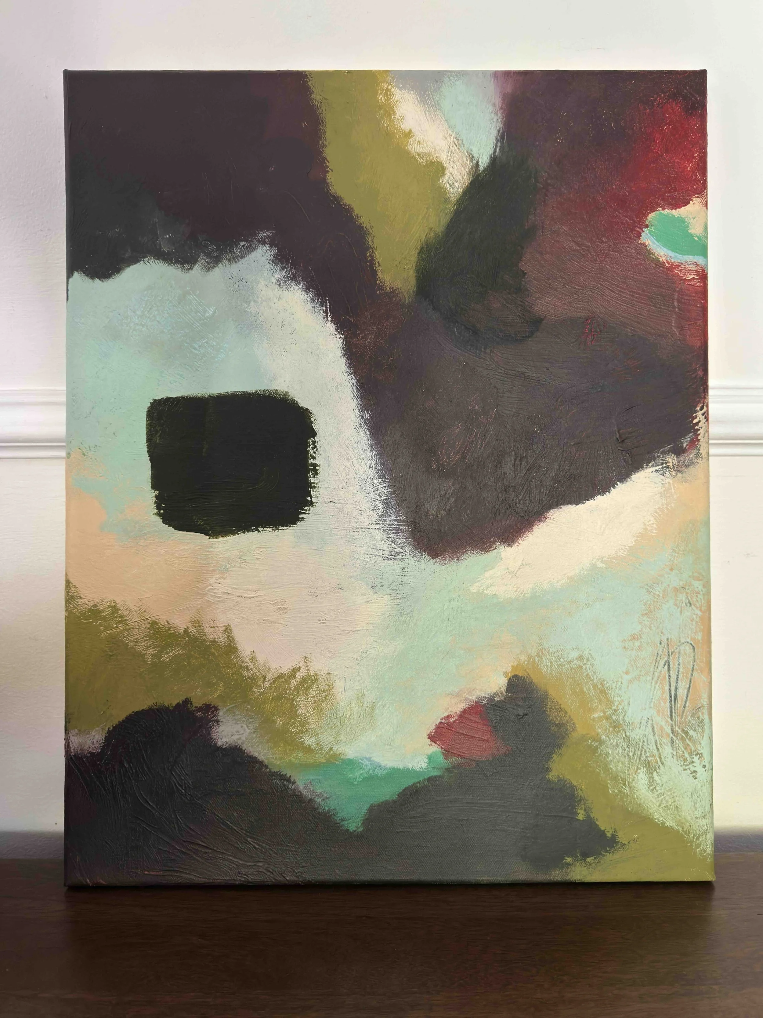 Abstract painting of a bear's face with dark and muted colors, including black, white, green, red, yellow, and purple.