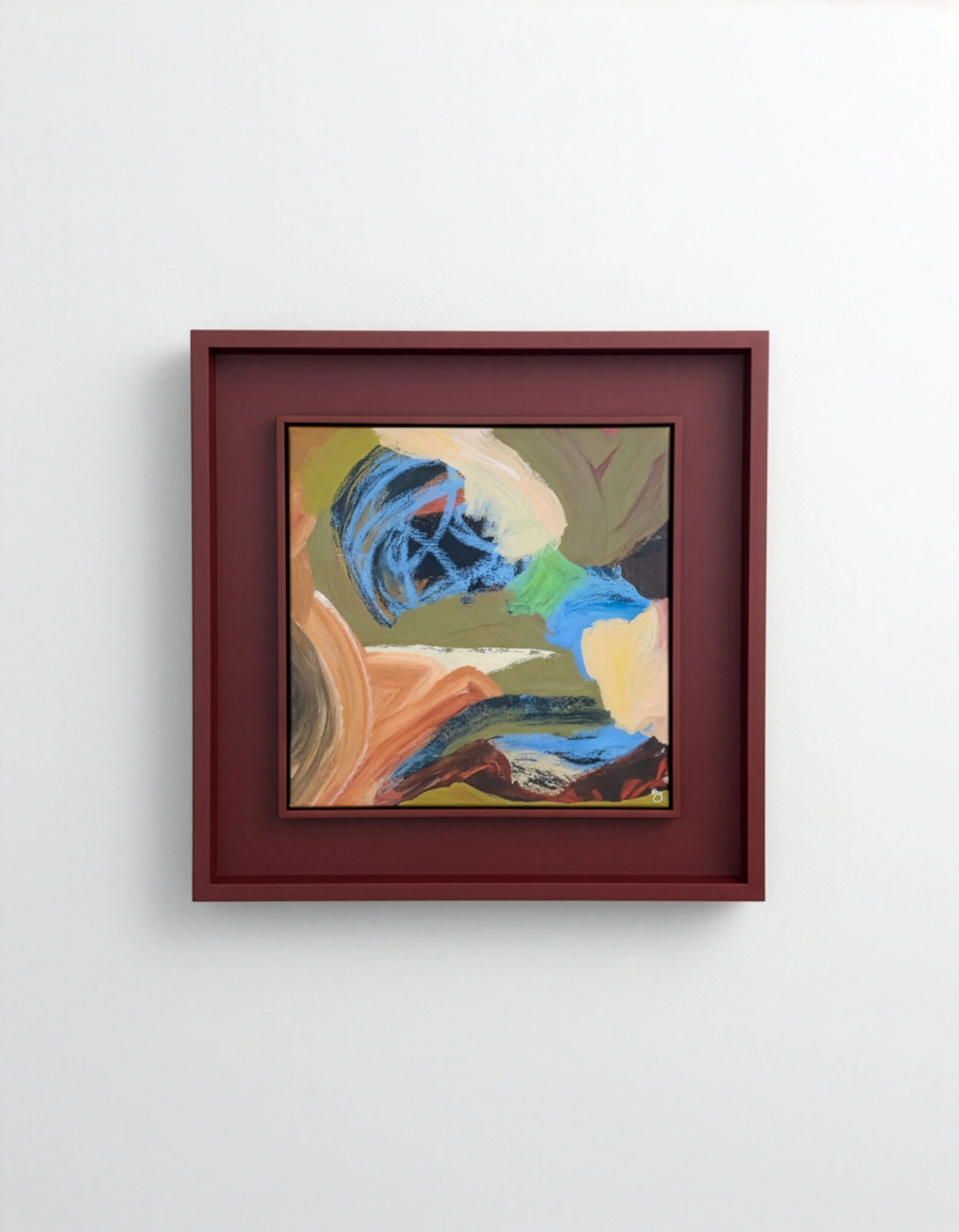 Abstract painting with swirls of blue, beige, green, orange, and black, framed in a red square frame, hung on a white wall.