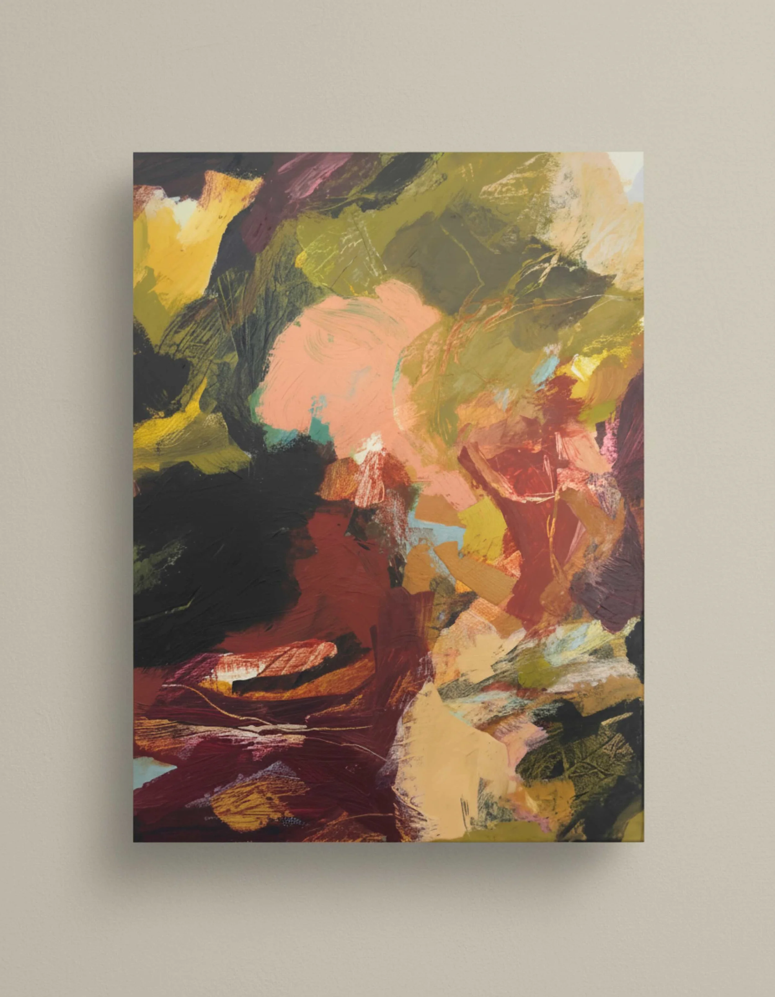 Abstract painting with various colors, including pink, black, red, green, and yellow, hung on a plain wall.