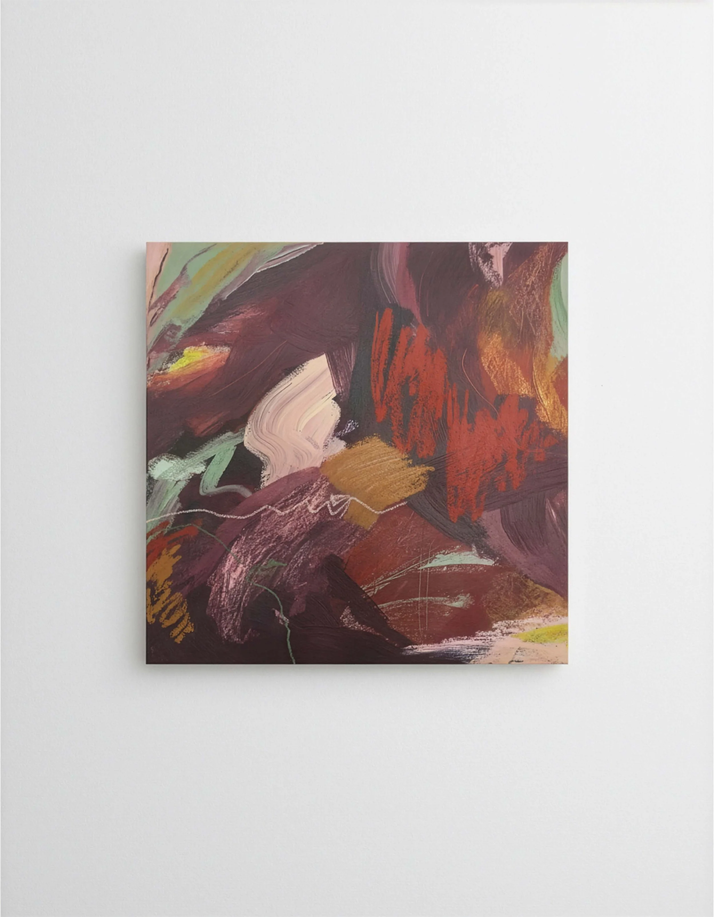 Abstract modern art painting with bold brushstrokes in shades of maroon, red, pink, gold, and green, displayed on a white gallery wall.