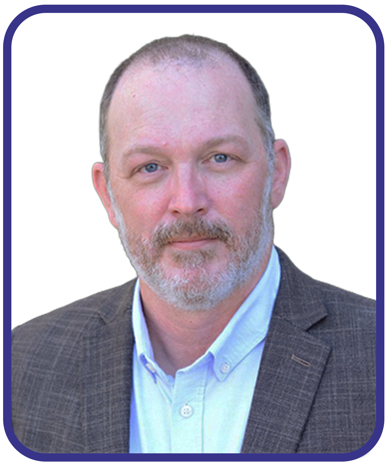 Portrait of a middle-aged man with blue eyes, light facial hair, dressed in a brown checkered blazer and light blue shirt, against a plain white background.