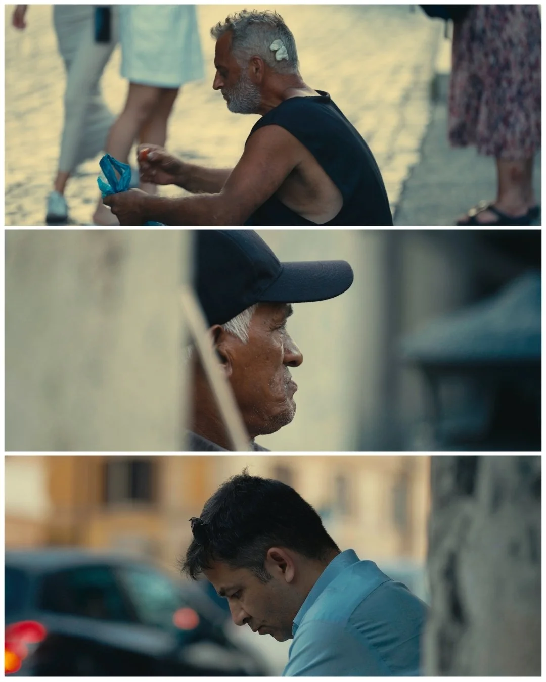 Three men sitting and resting in an urban outdoor setting, each shown in profile. The top man has gray hair and a beard, wearing a black sleeveless shirt, and appears to be touching something in his hands. The middle man has a light gray beard and is