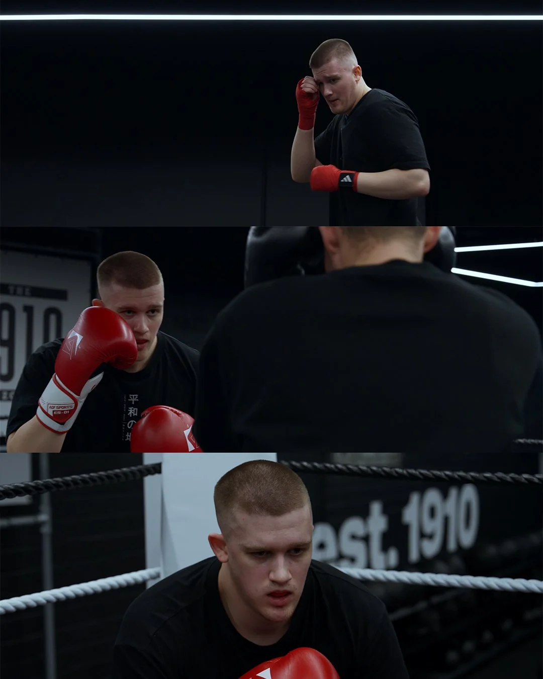 A boxer in black shirt with red gloves training and resting in a gym.