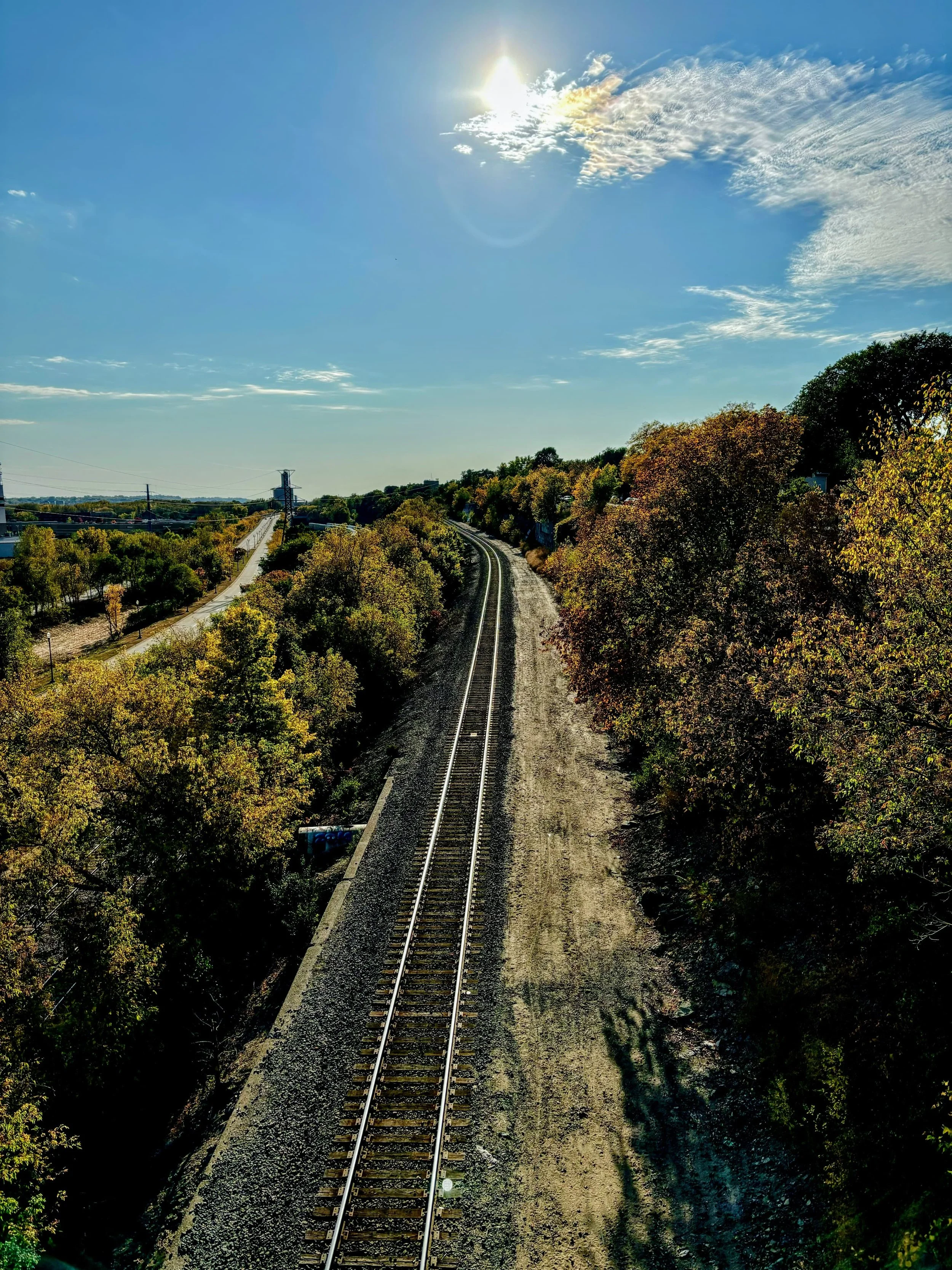 Train tracks disappearing into the distance on a sunny fall day. Taken by Kalin Schoephoerster.