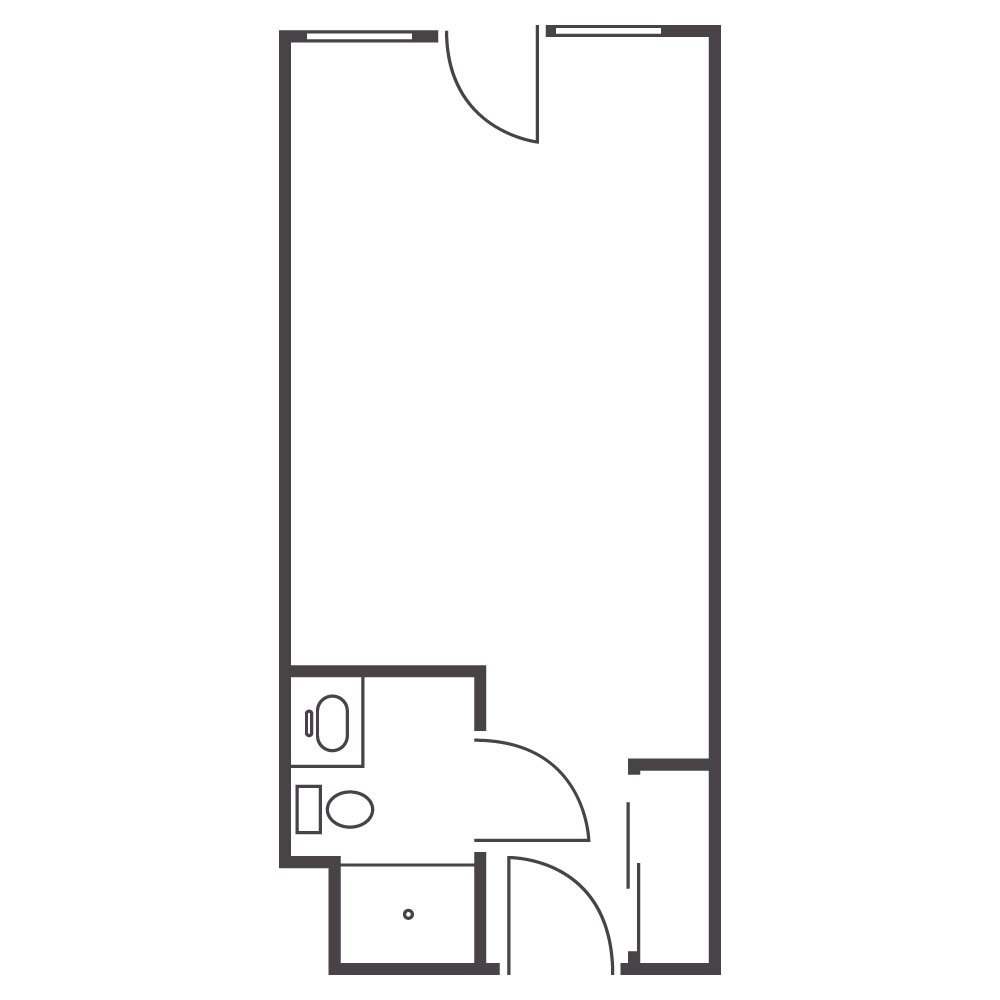 Floor plan of a small apartment or hotel room with a bathroom, entry, and open main living space.