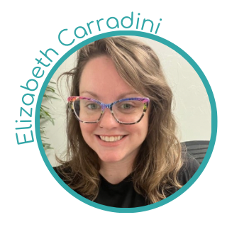 A woman with wavy blonde hair wearing colorful glasses smiling in an indoor setting.