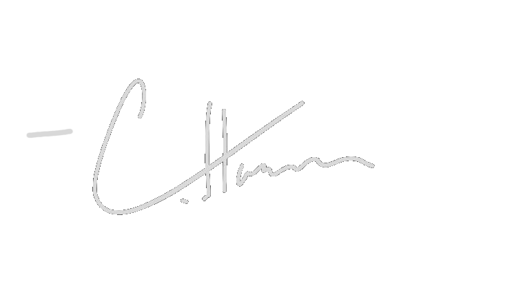 Signature of Charles Manson on a black background.