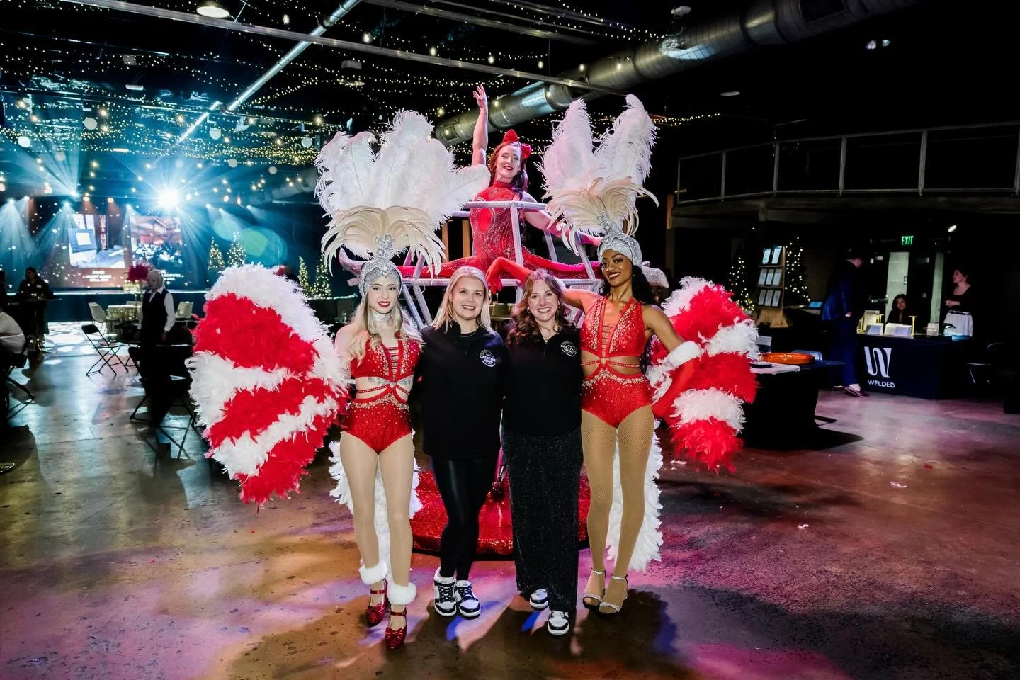 The ILEA Holiday Casino Soir&eacute;e turned into a red-hot Vegas night with showgirls welcoming guests and blackjack, roulette, and craps tables running throughout the evening. Red feathers and sequins set the tone across the room, with a holiday ve