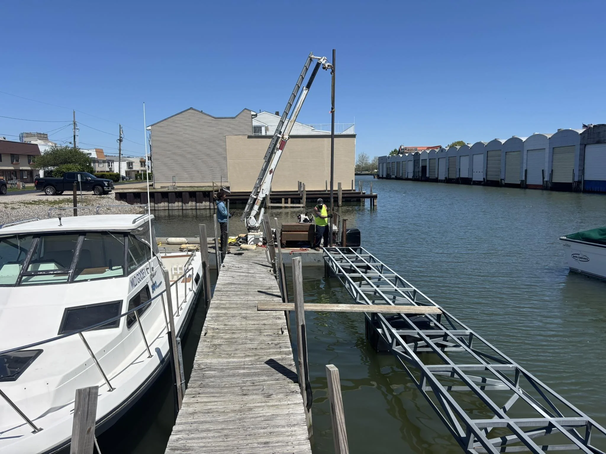 A custom dock being installed and piling being driven to the seabed by Pipe Creek Enterprises