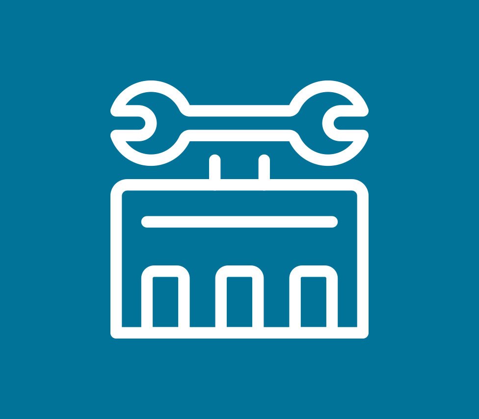 Icon of a toolbox containing a wrench and a screwdriver.