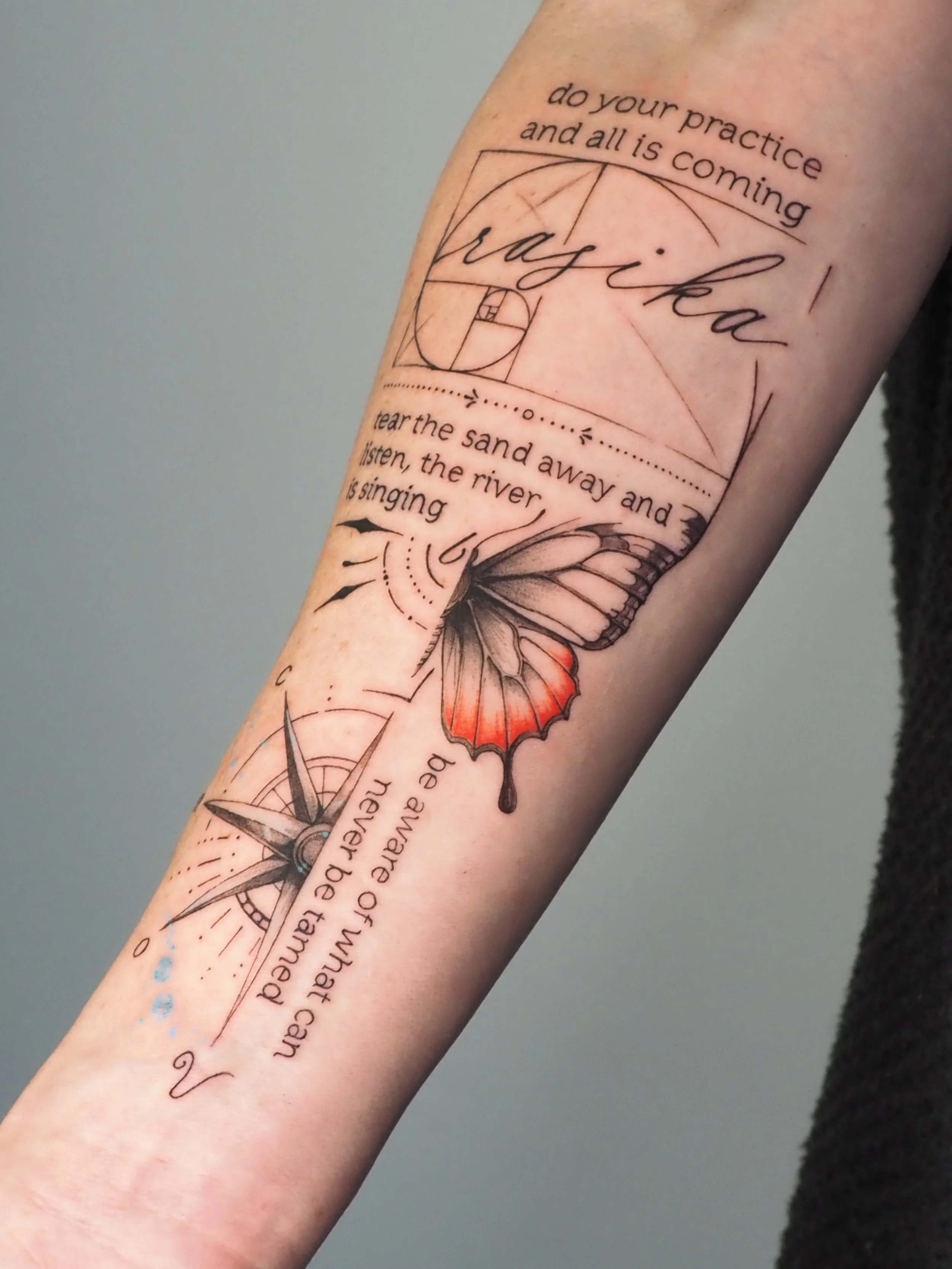 Tattoo on forearm featuring a butterfly, a compass, geometric shapes, and motivational quotes about practice, wisdom, and nature.