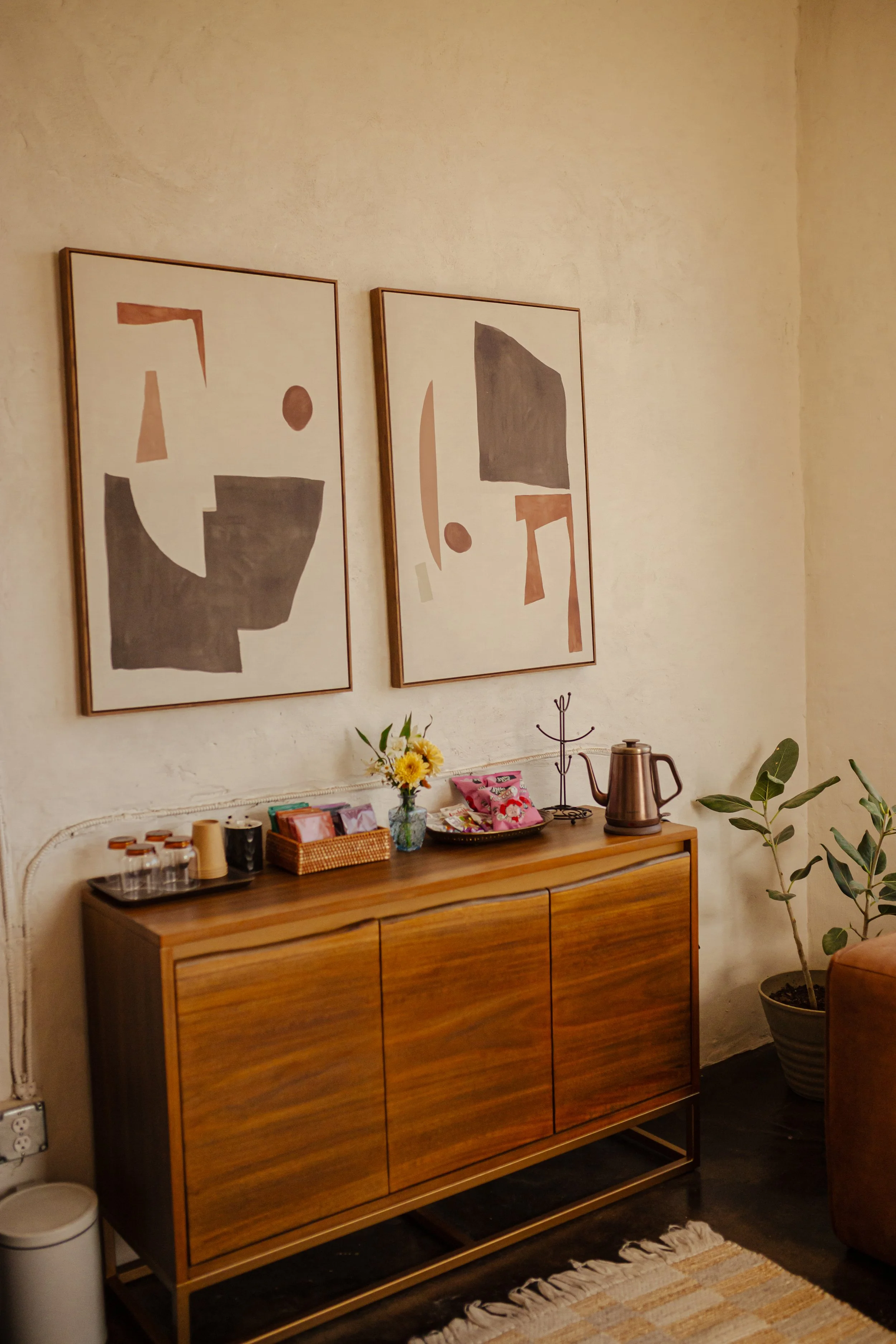 Calm spa lounge area with refreshments and seating inside a holistic wellness space in Oklahoma City