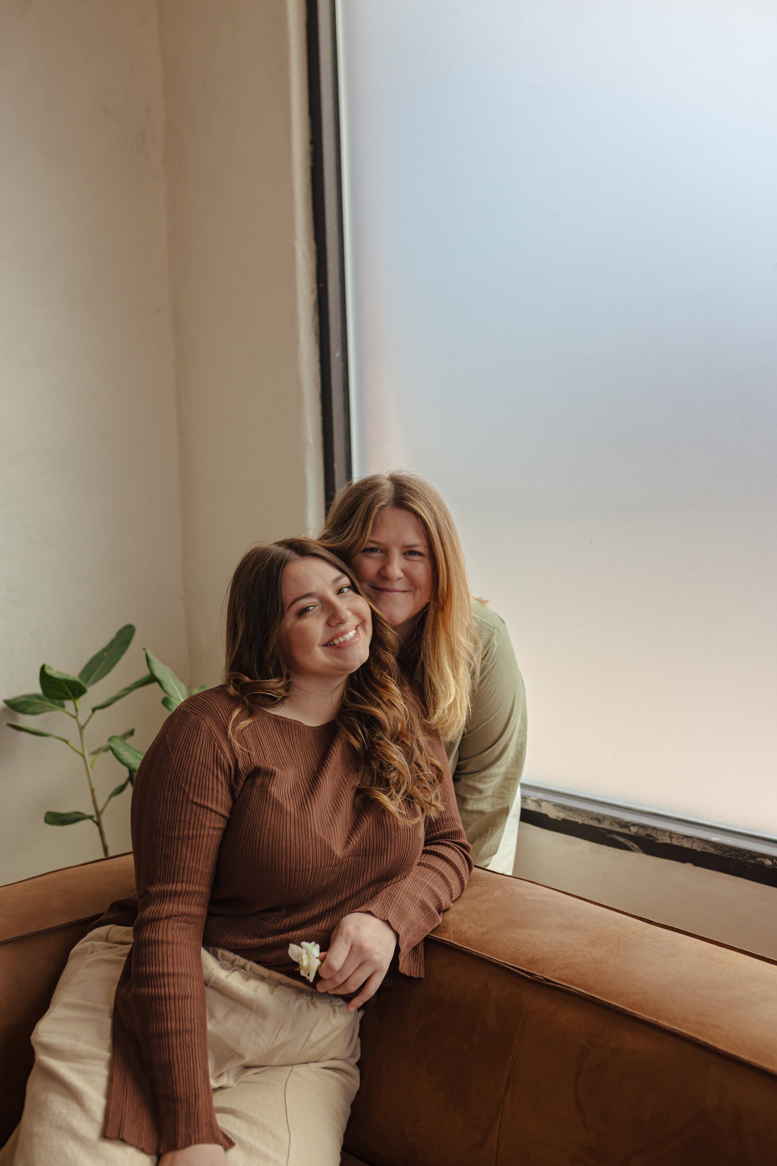 Owners of a holistic wellness spa smiling together in Oklahoma City