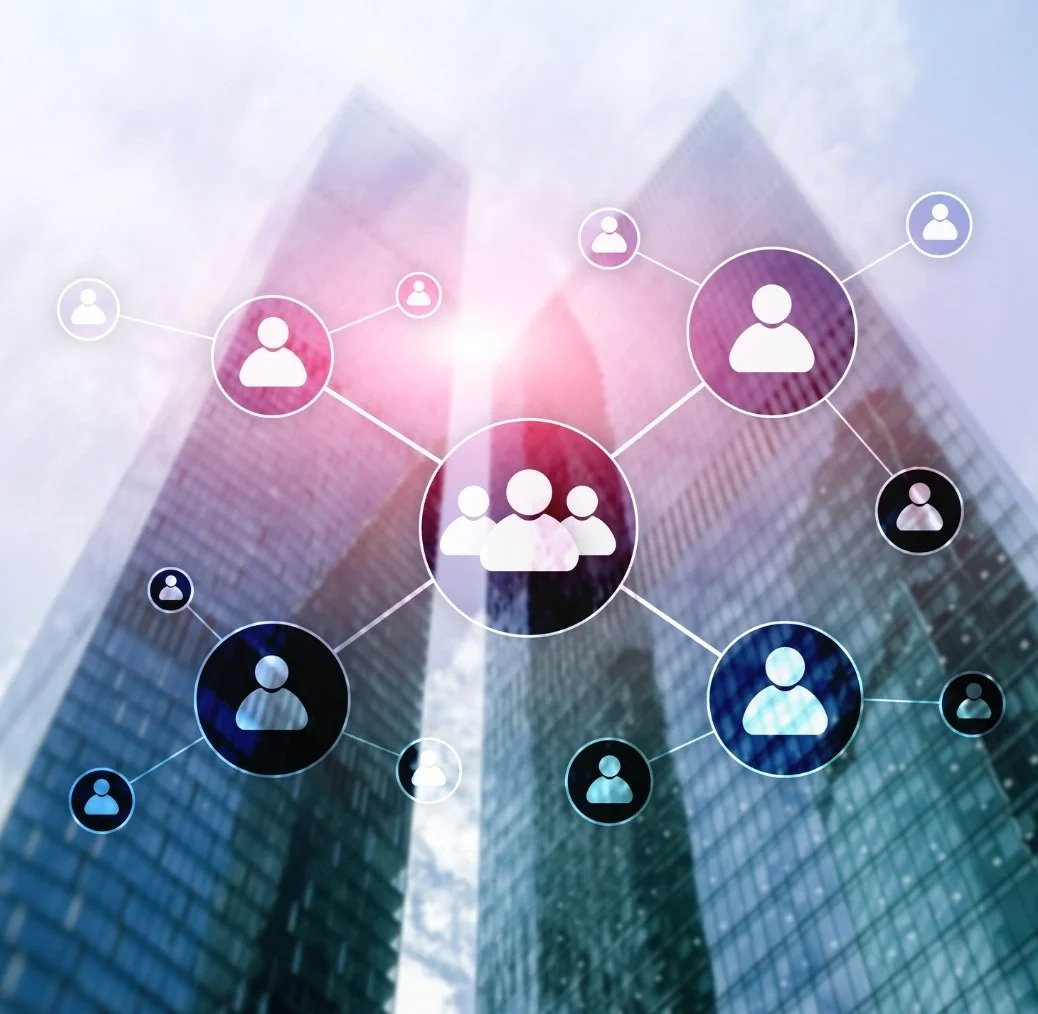 Overlay of connected user icons on a tall modern glass building with a bright sky background, representing networking or social connections.