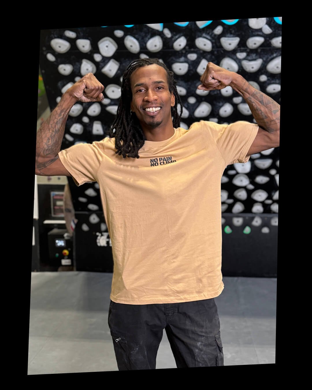 Professional climber Mickael Mawem in a climbing gym.