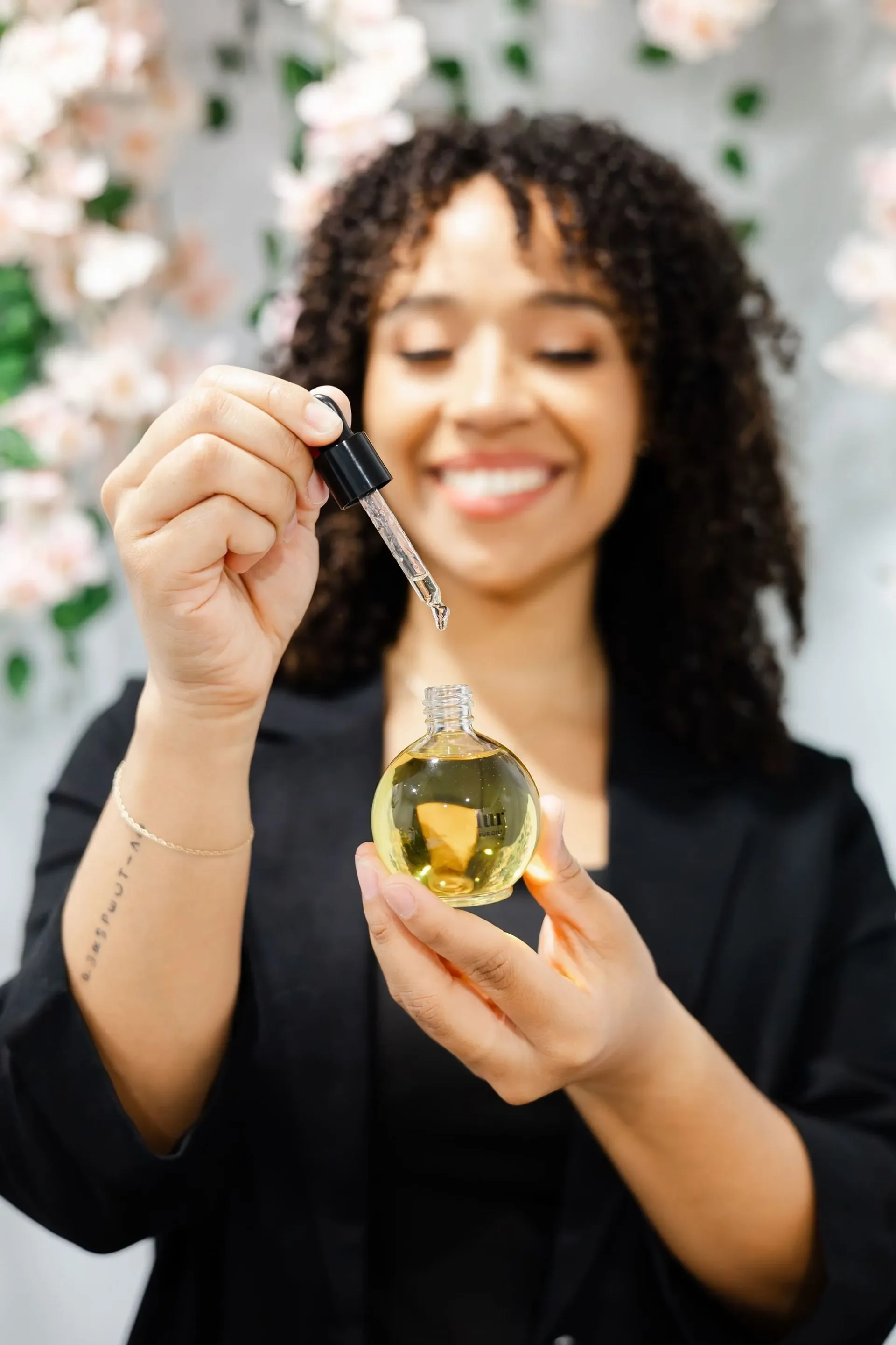 happy client with skincare serum, waxing tampa