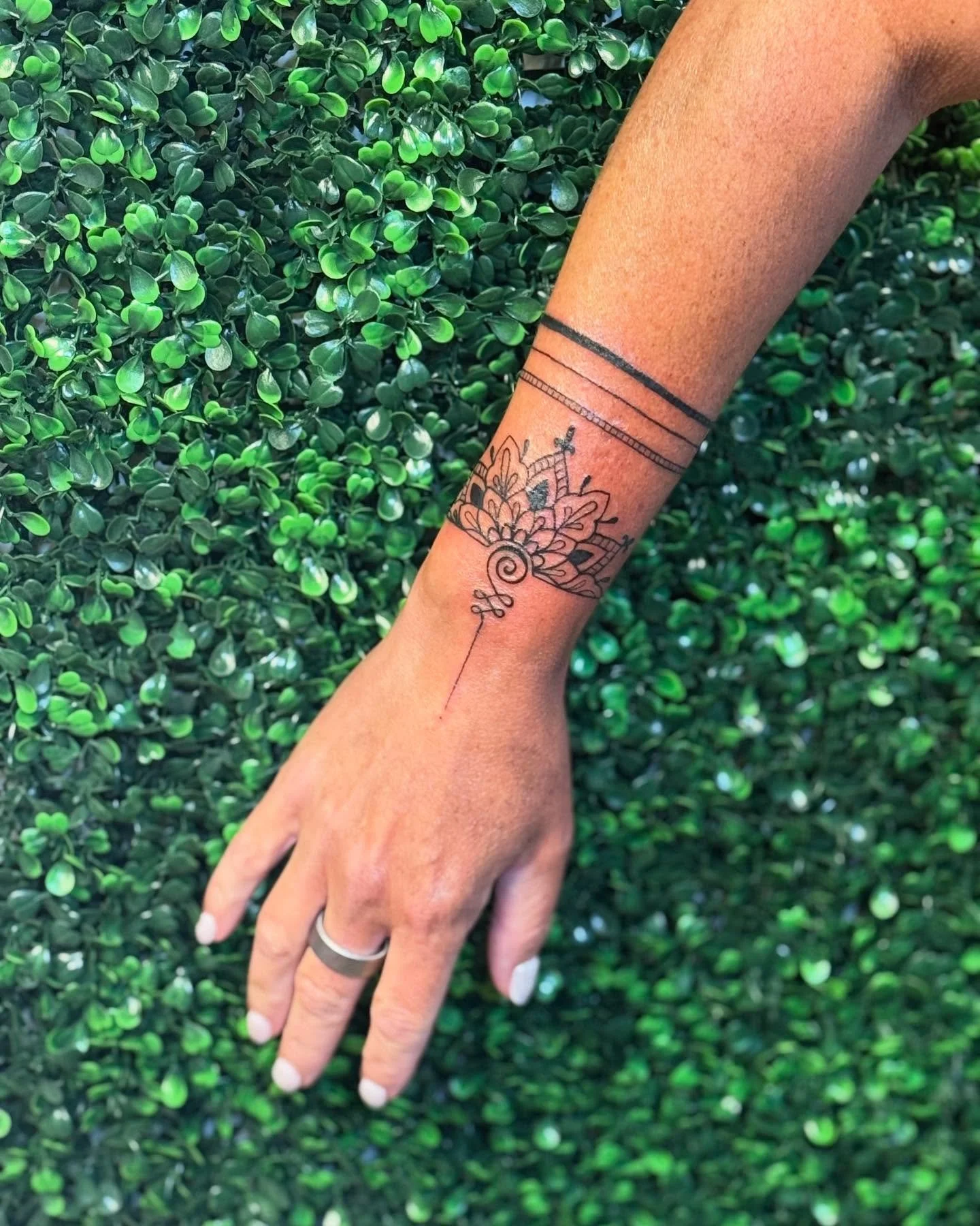 tattoo on woman's arm, fine line tattoos tampa
