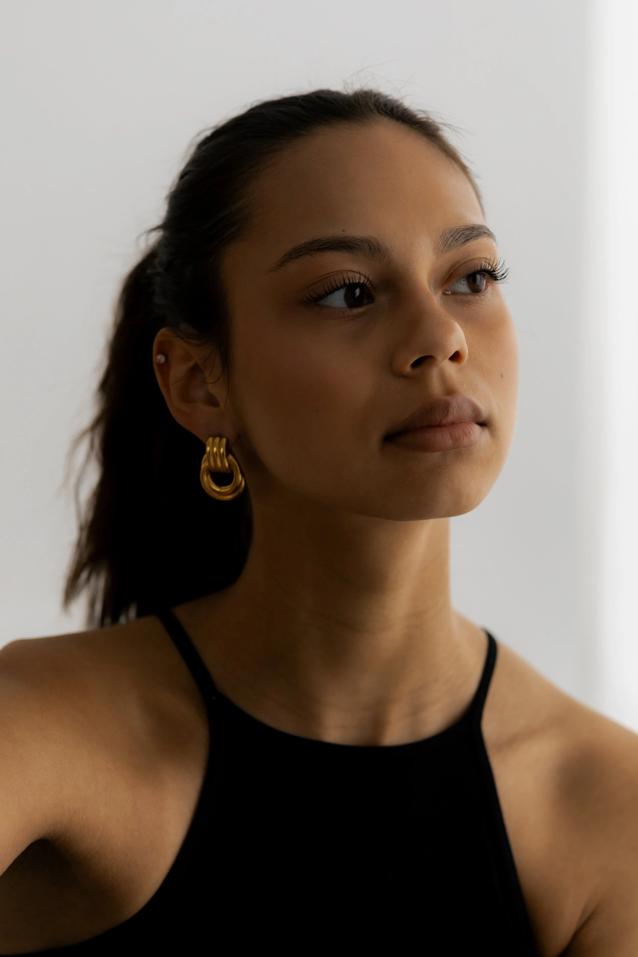 woman looking off in distance, lash and brow tint near me