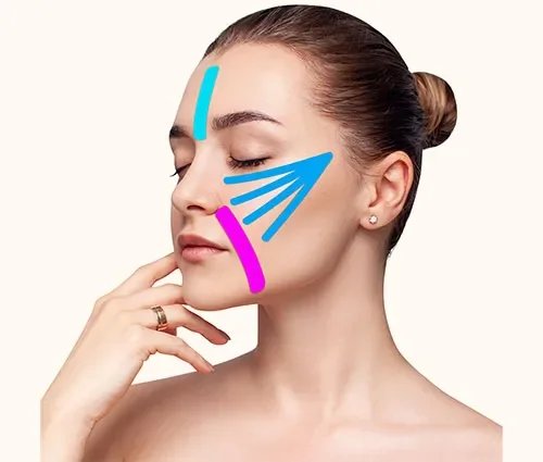 A woman with her eyes closed showing colorful lines on her cheek, chin, and forehead.