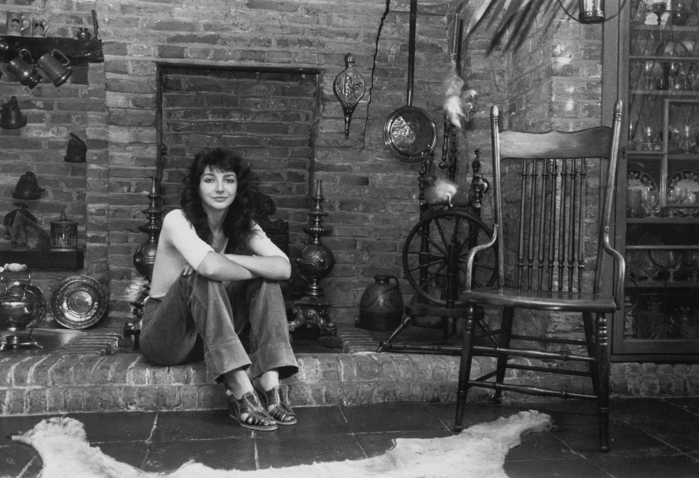 Kate Bush sitting in studio with vintage equipment, black and white photograph by Chris Moorhouse, Getty Images