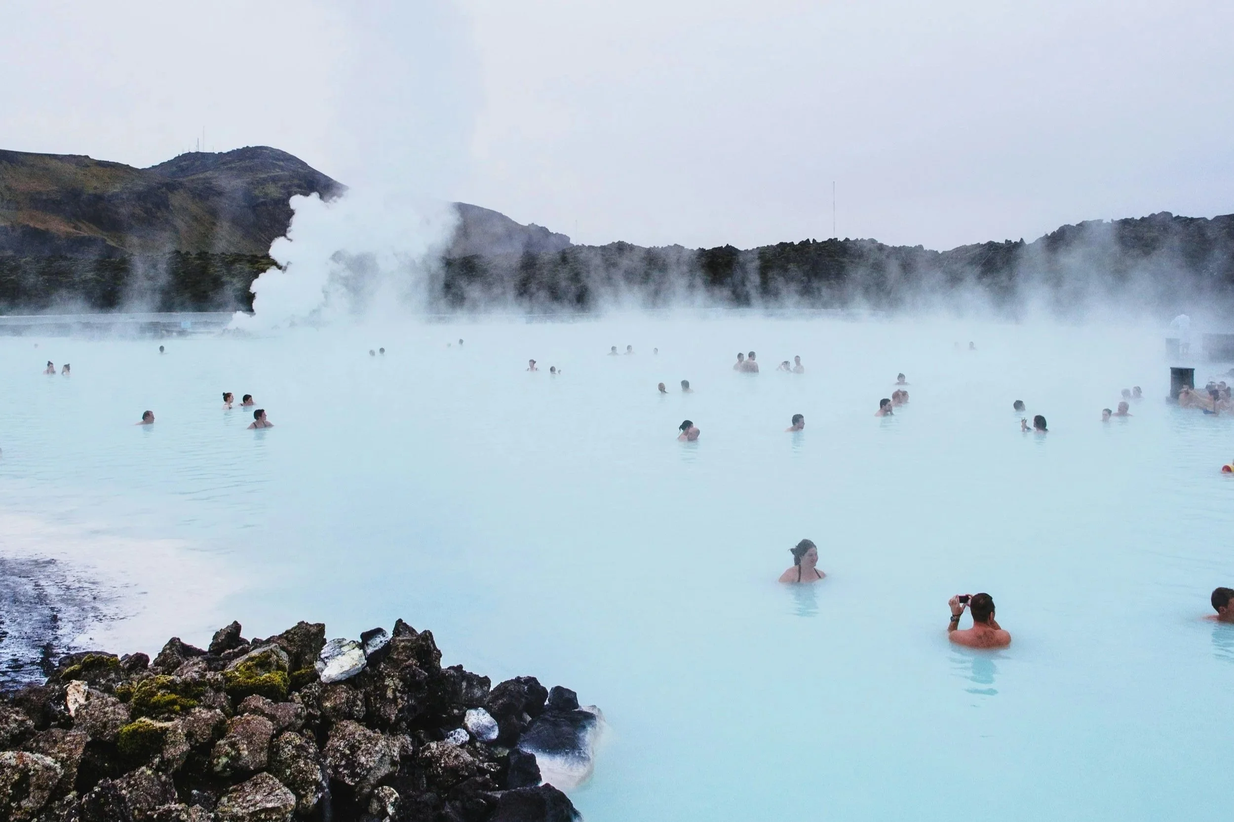 Geothermal pool in Iceland with steam over the water
