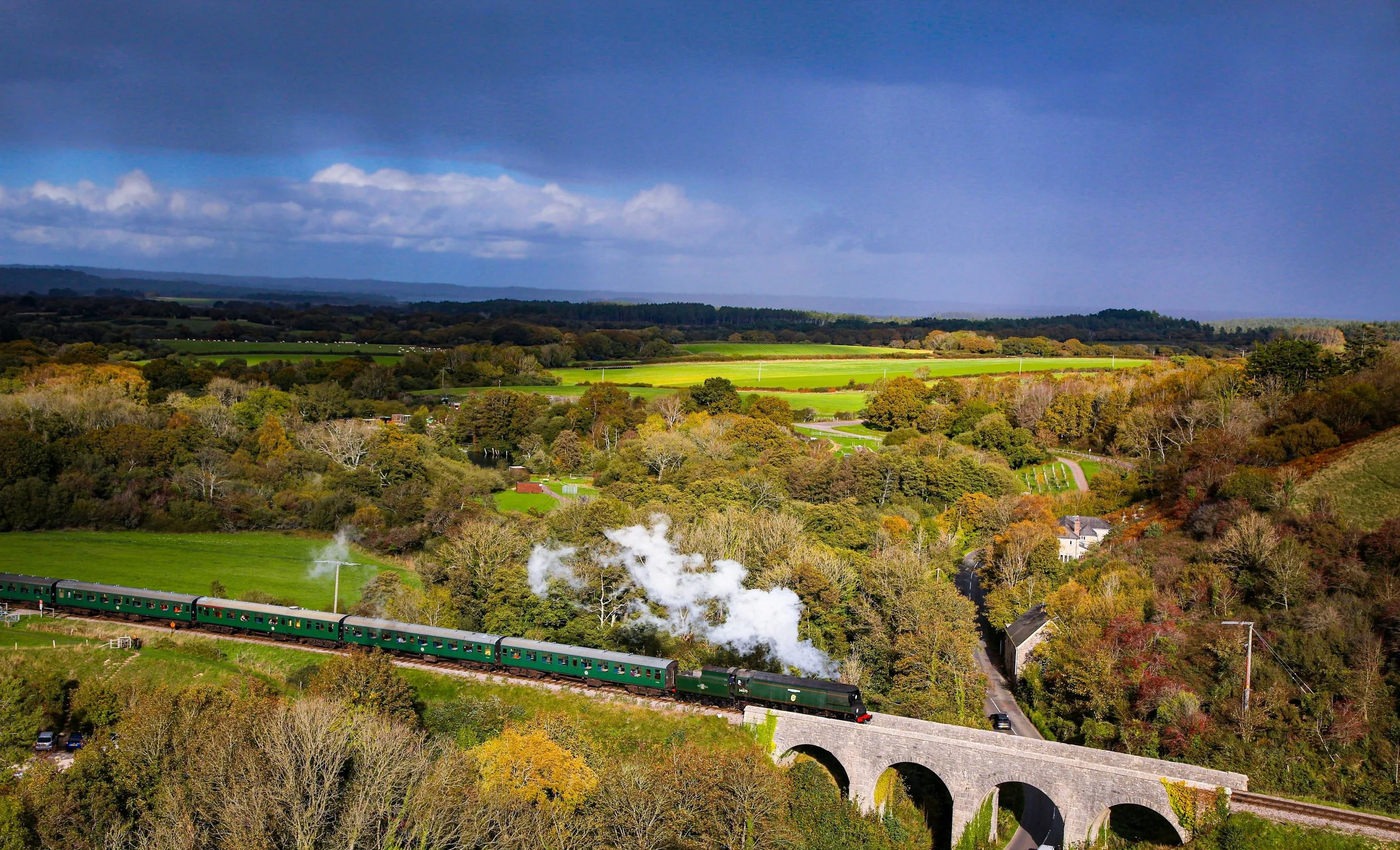 Train traveling through scenic countryside