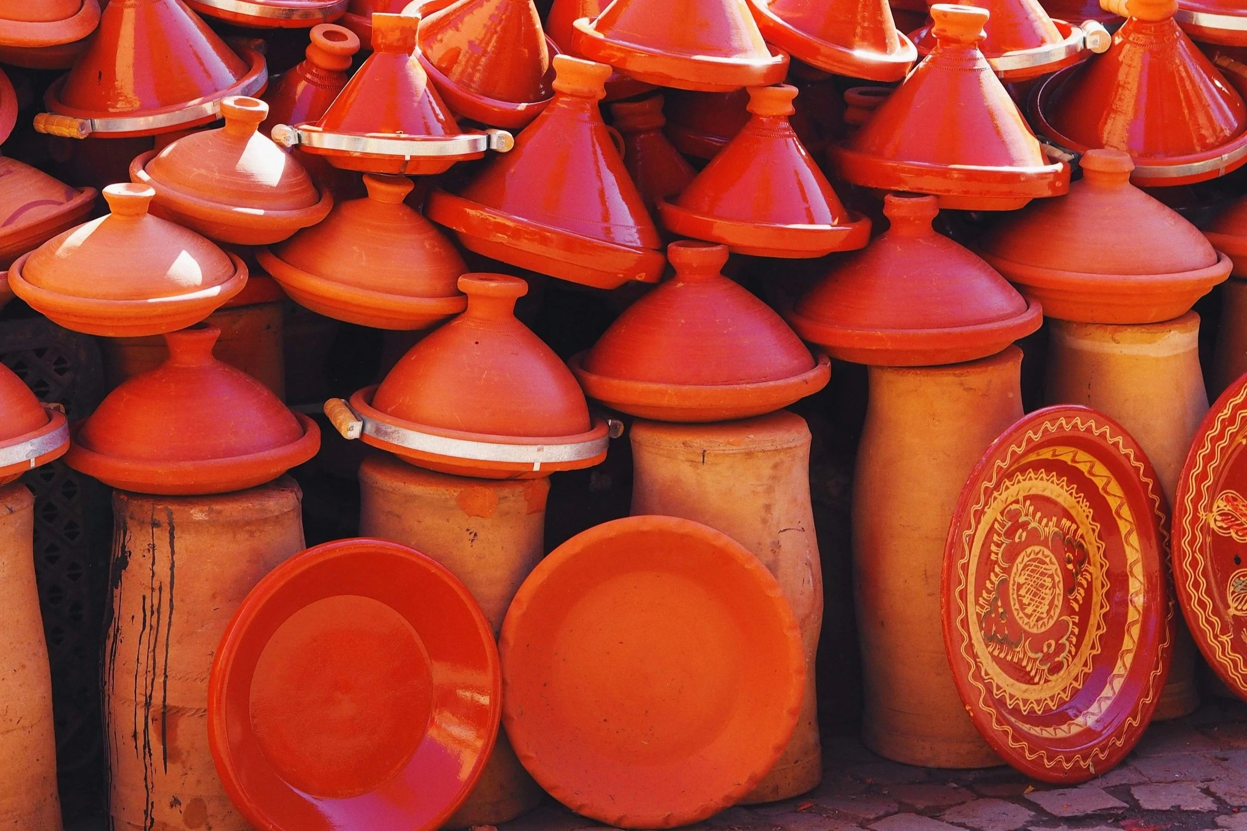 Artisan hand-forming pottery at a family-run studio in Morocco