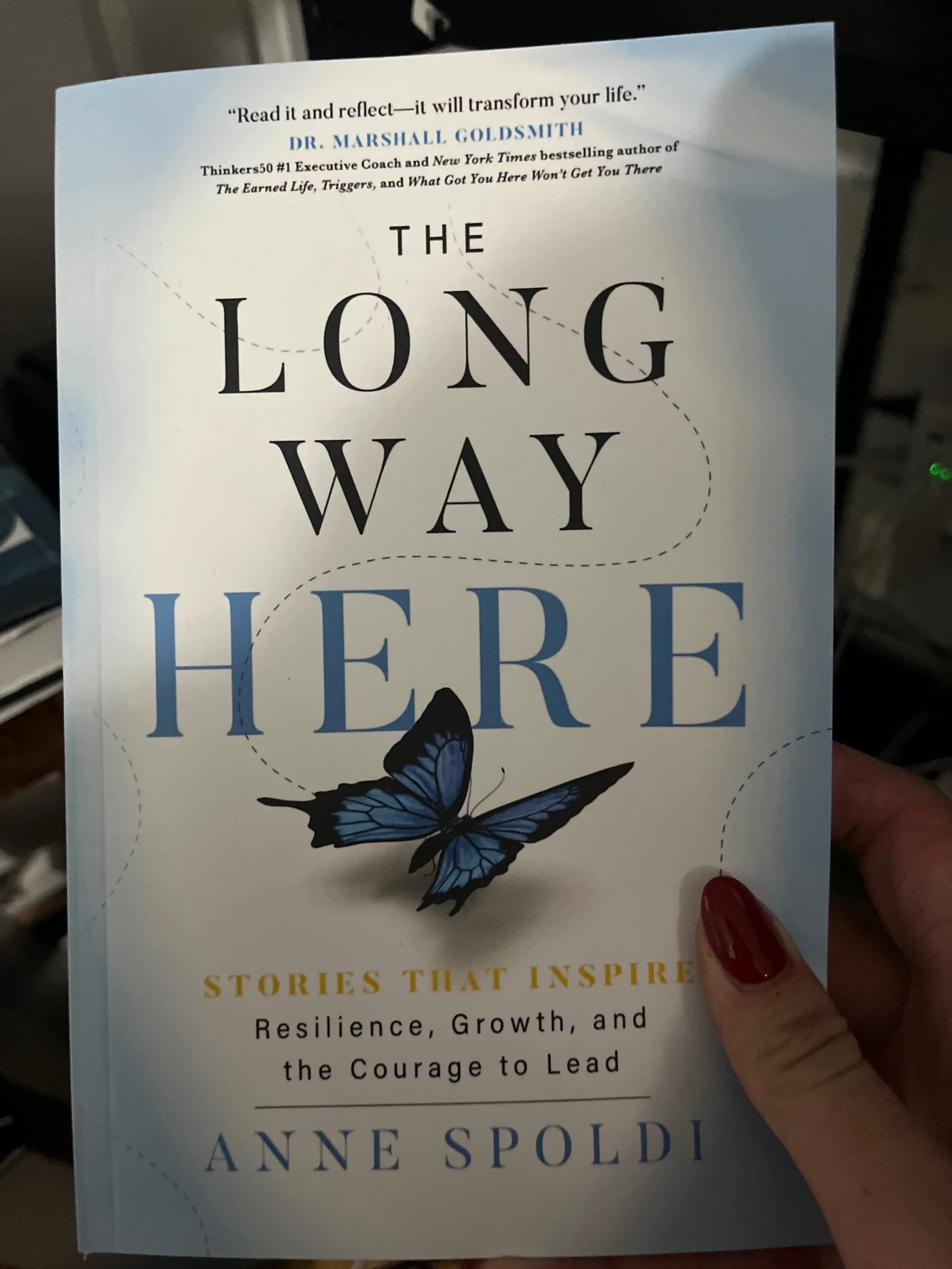 Woman holding my book.jpg