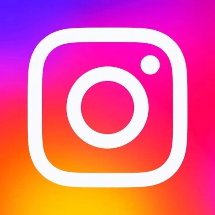 Instagram logo with white camera outline on a colorful gradient background of pink, purple, orange, and yellow.