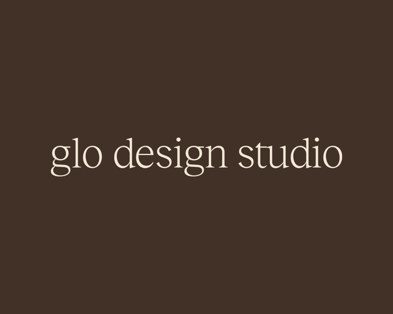 Brown background with white text that reads "glo design studio."