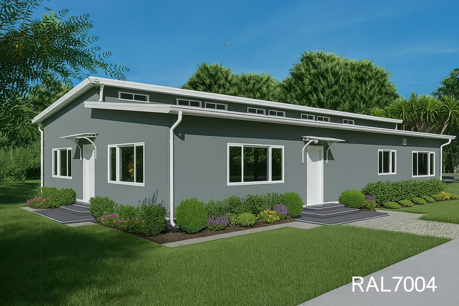 A single-story modern house with gray exterior, white trim, flat roof, several windows, small front porch, and landscaped lawn with bushes and flowers.