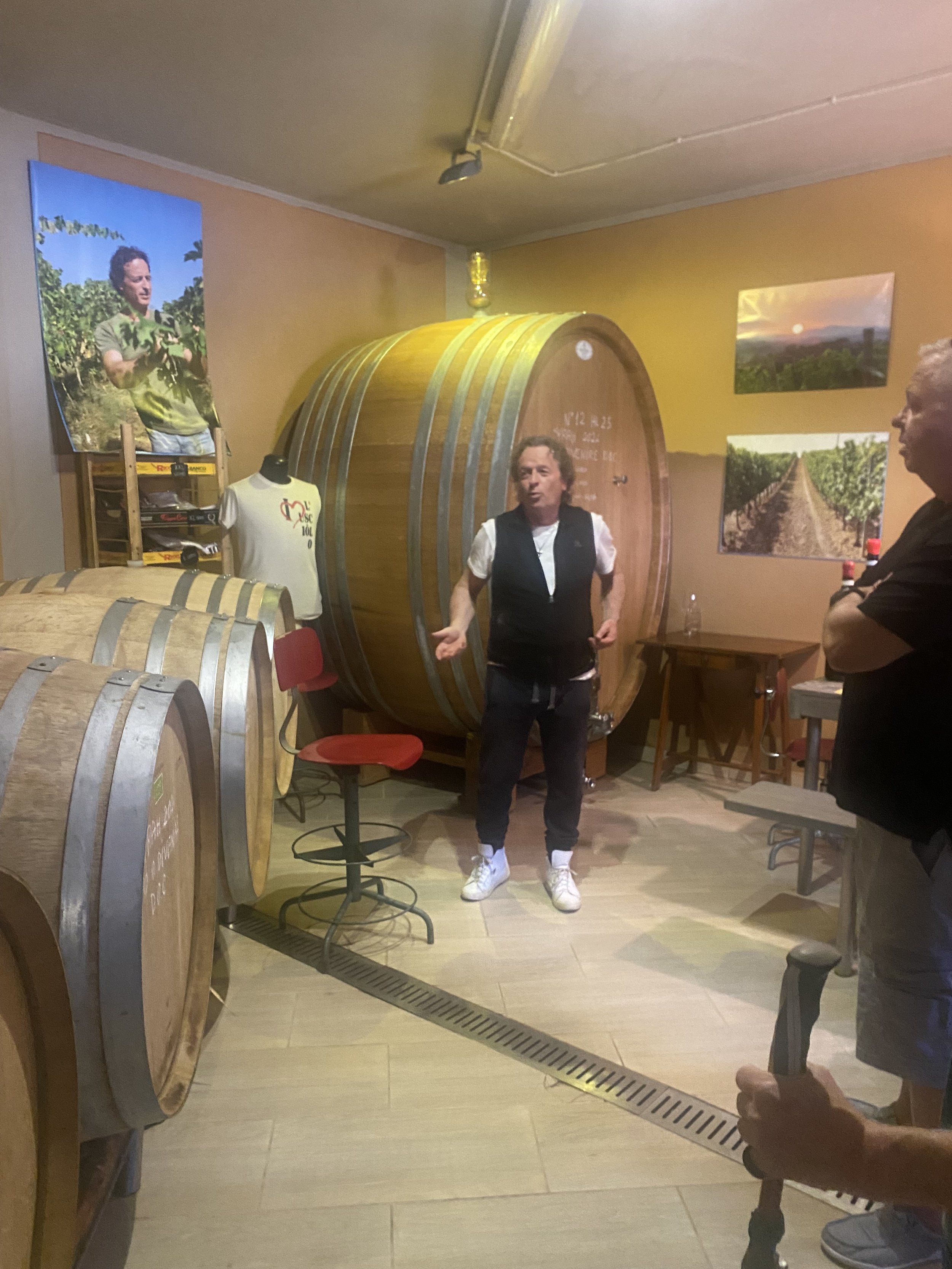 Wine cellar with barrels &amp; person