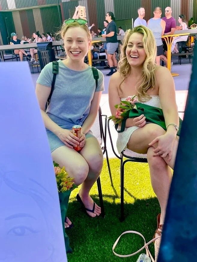 Minneapolis caricature artist drawing reveal women laughing mn