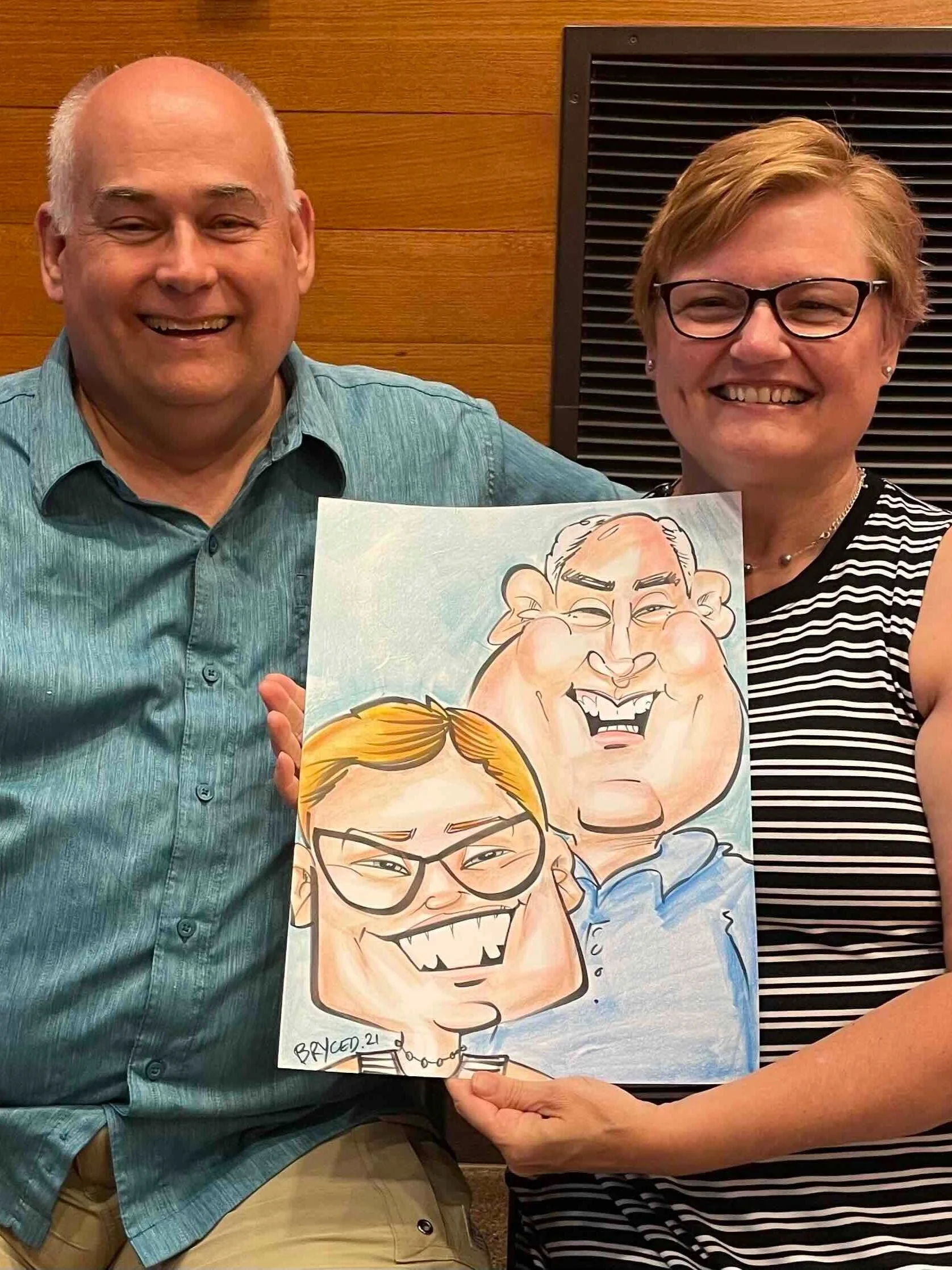older couple color caricature employee party minnesota twin cities smiling laughing