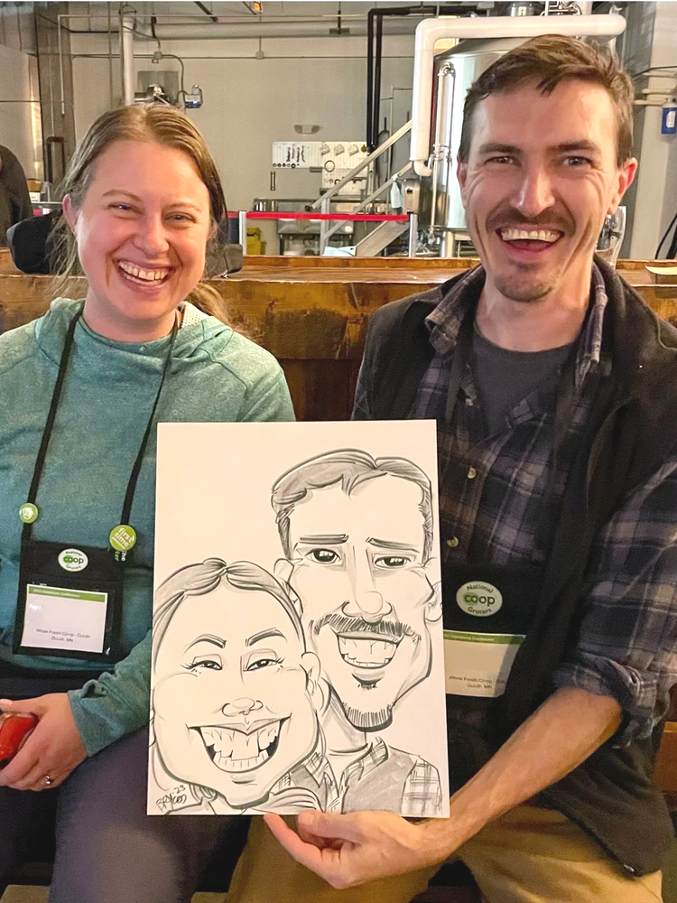 Caricature artist drawing guests at a company party in Minneapolis Twin Cities Minnesota brewery event