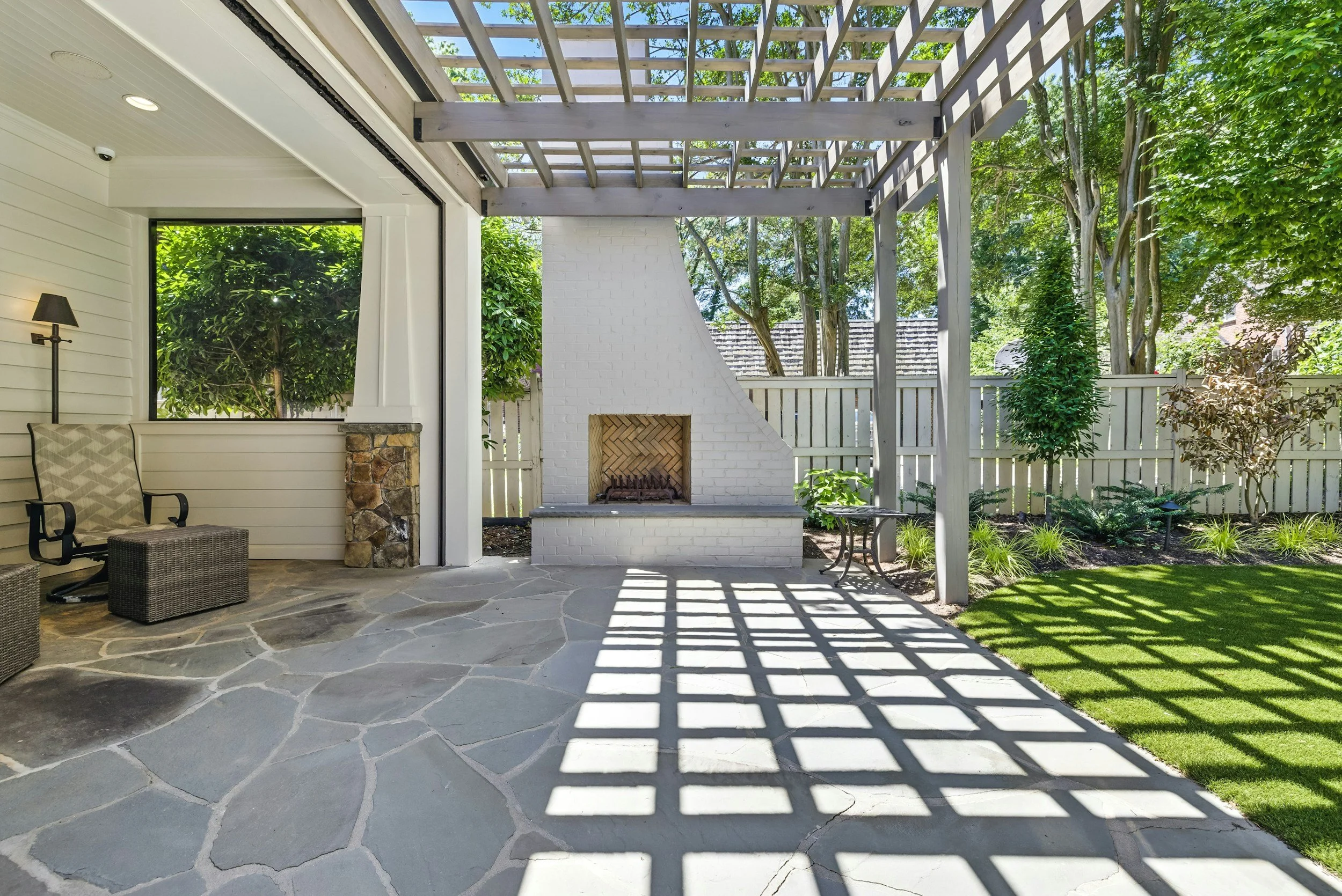 Wooded backyard patio of a custom home in Scenic Oaks, Rochester MN